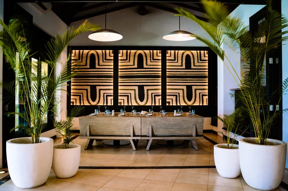 wave restaurant at northolme seychelles with modern tropical decor, indoor and outdoor seating, and ocean views