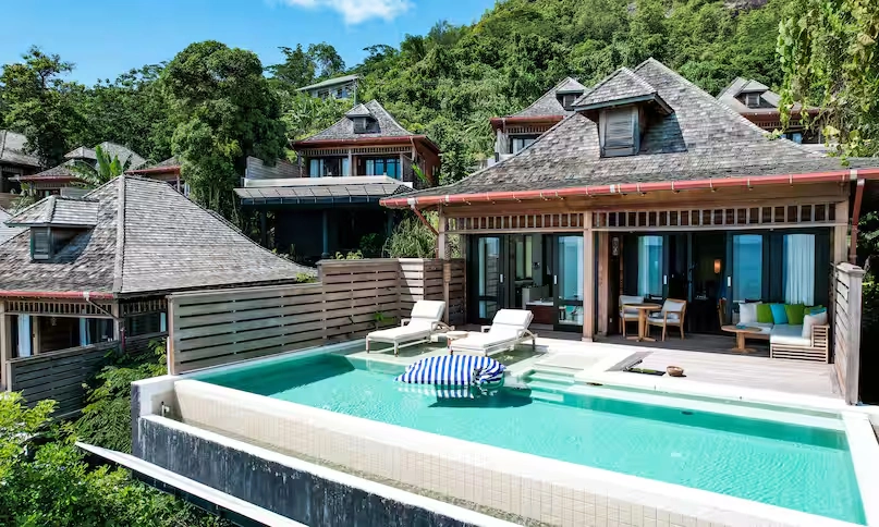 view of infinity pool at northolme signature grand ocean pool villa with panoramic ocean and tropical surroundings