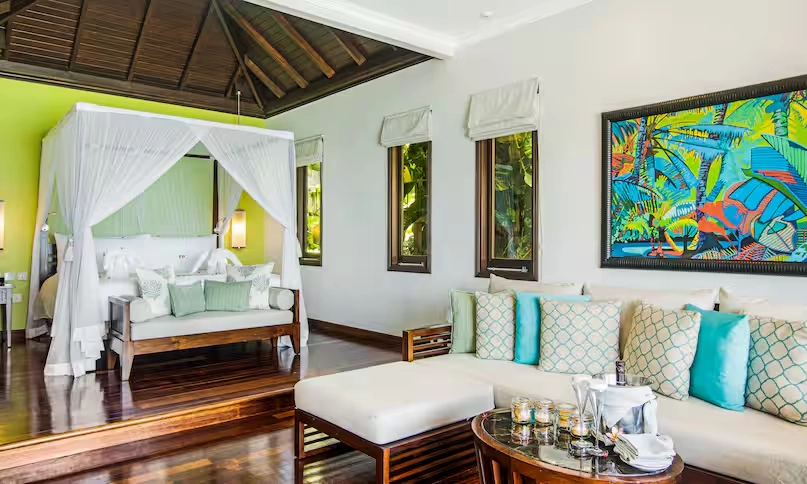 luxury room in northolme signature grand ocean pool villa with king bed, modern tropical decor, and panoramic ocean view
