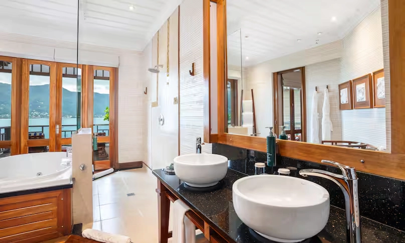 luxury bathroom sinks in northolme king sunset villa with elegant countertops and warm sunset light streaming through windows