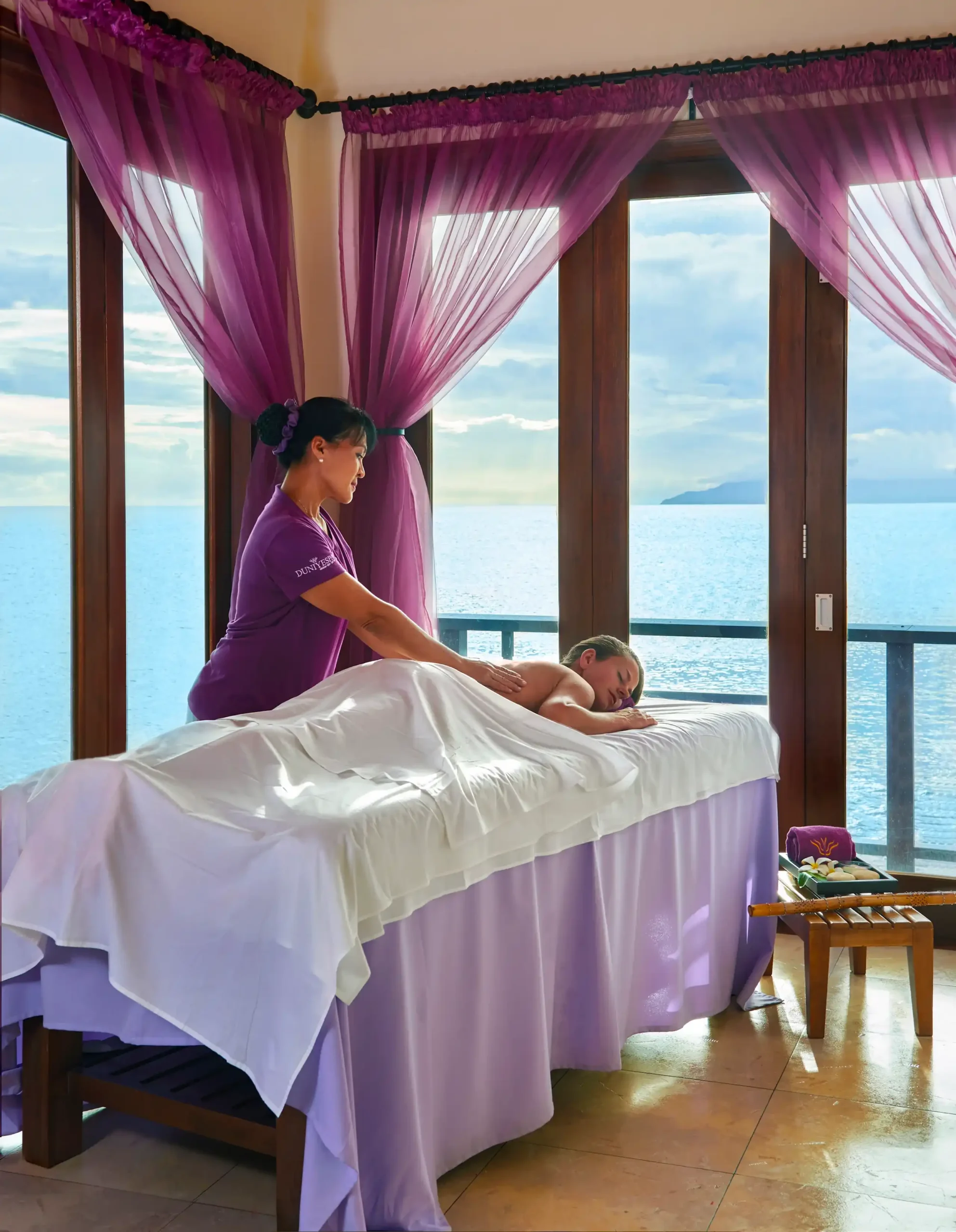 luxurious spa at northolme seychelles with massage tables, soft lighting, and tropical views