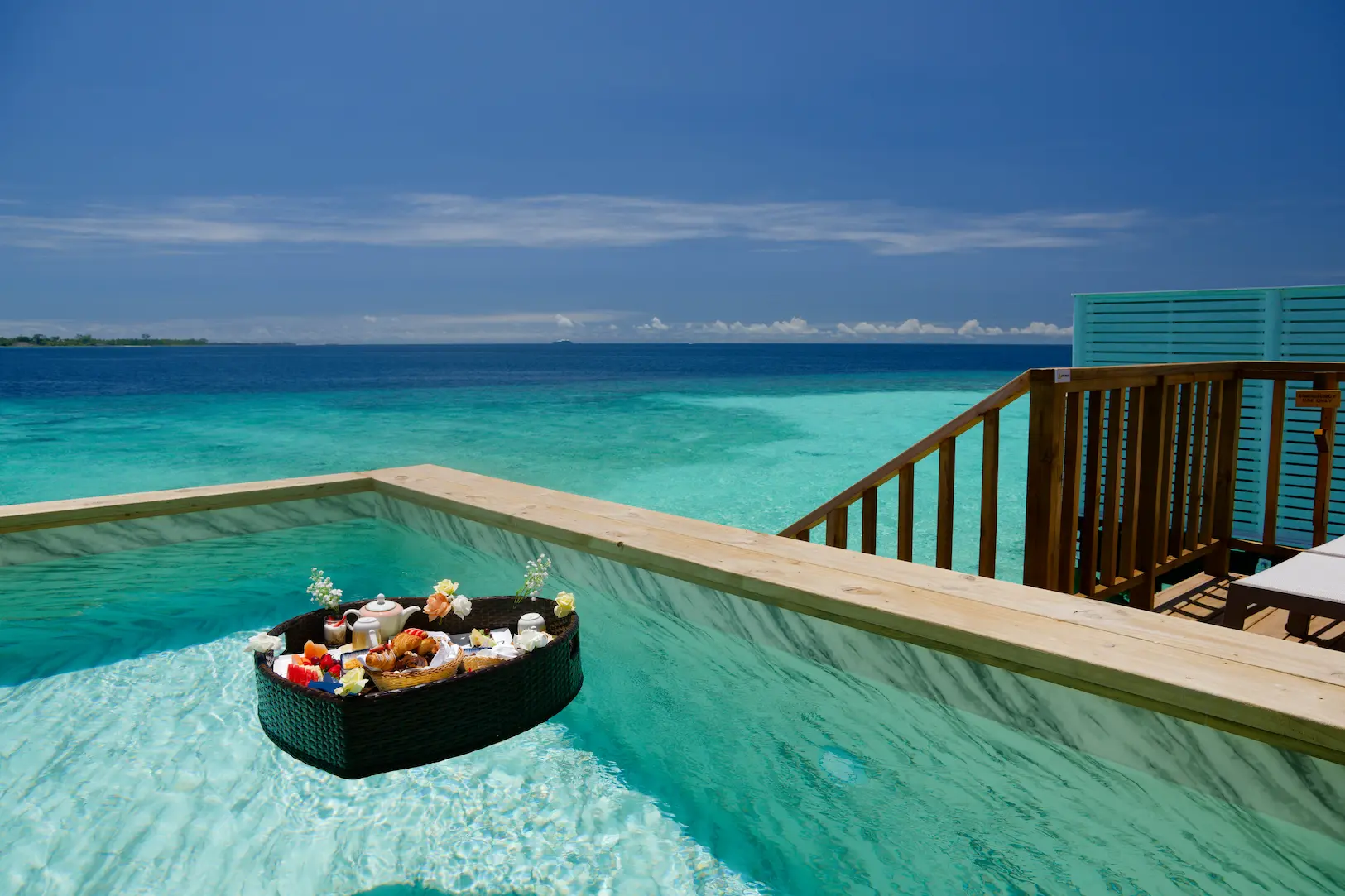 oblu nature helengeli activities and services floating breakfast featuring serene poolside setting elegant island presentation and a calm luxurious morning ambience
