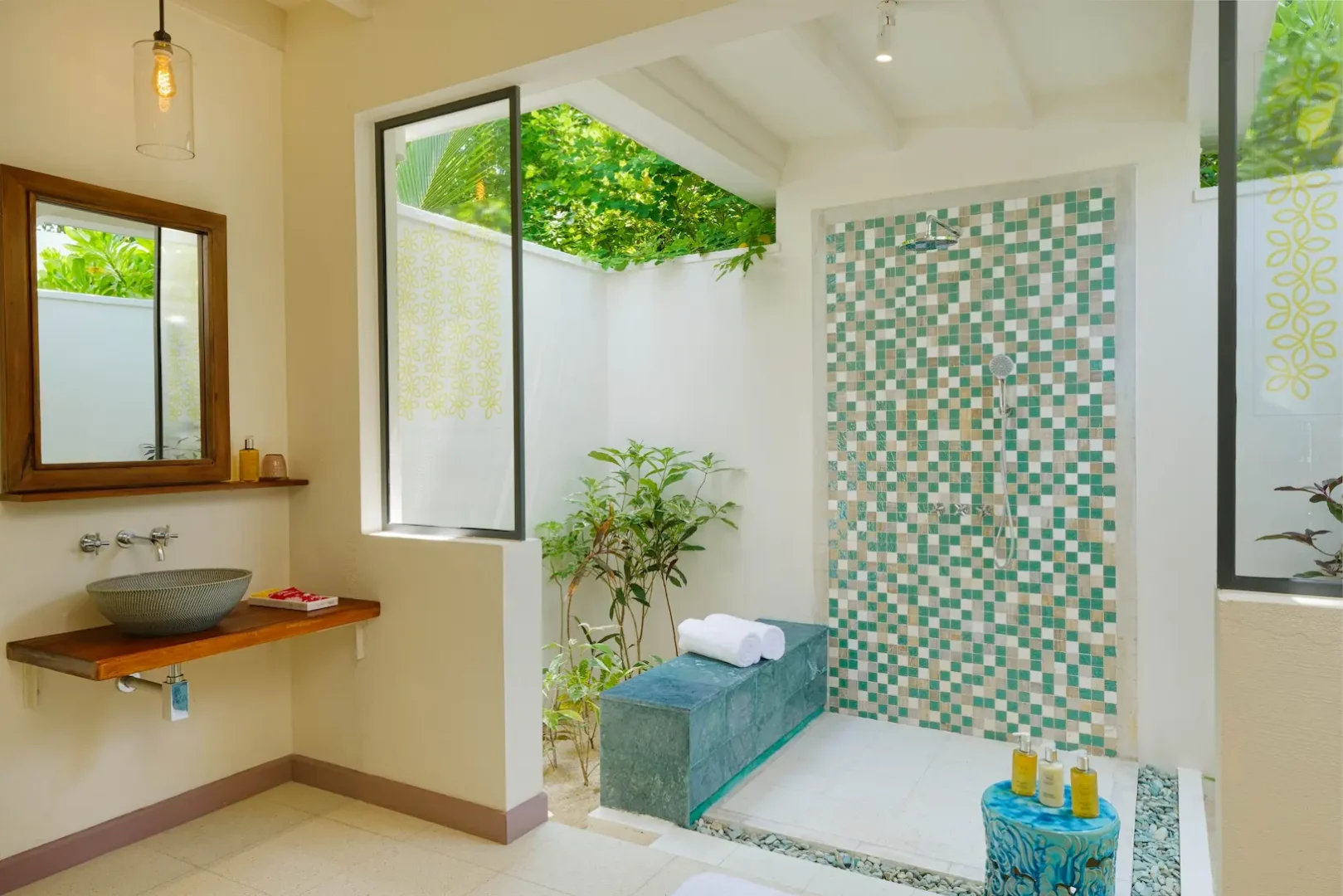 oblu nature helengeli deluxe beach villa with pool bathroom shower featuring elegant island styling smooth natural textures and a calm spa like atmosphere