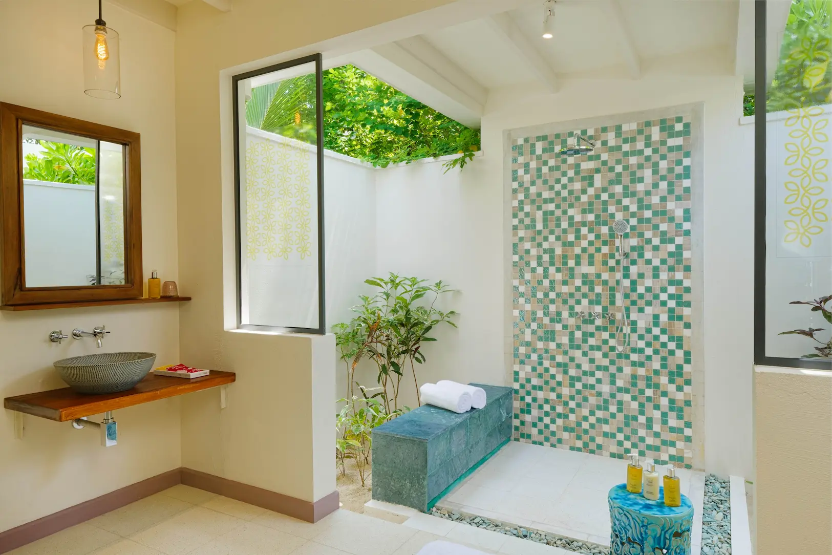 oblu nature helengeli deluxe beach villa with pool bathroom shower featuring elegant island styling smooth natural textures and a calm spa like atmosphere