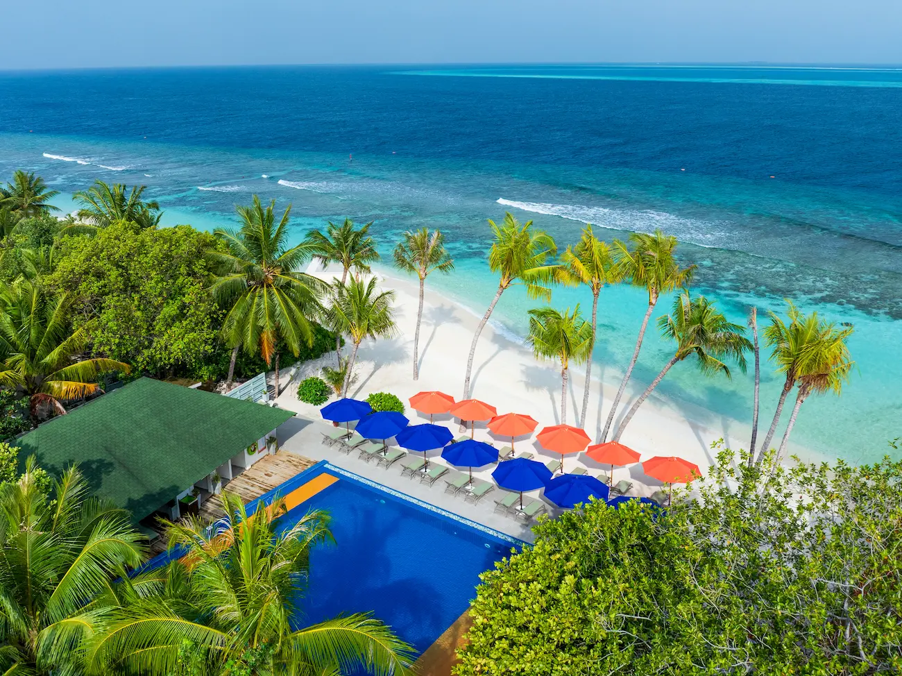oblu nature helengeli raa bandhi bar pool aerial featuring serene ocean views vibrant island ambience and a calm relaxed poolside atmosphere