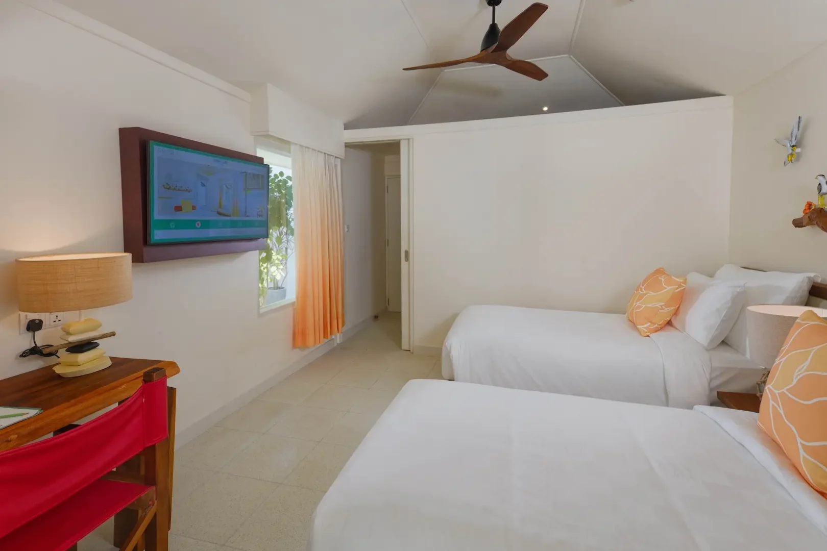 oblu nature helengeli two bedroom family villa with pool interior twin bed tv setup featuring soft natural tones relaxed island styling and a calm inviting atmosphere