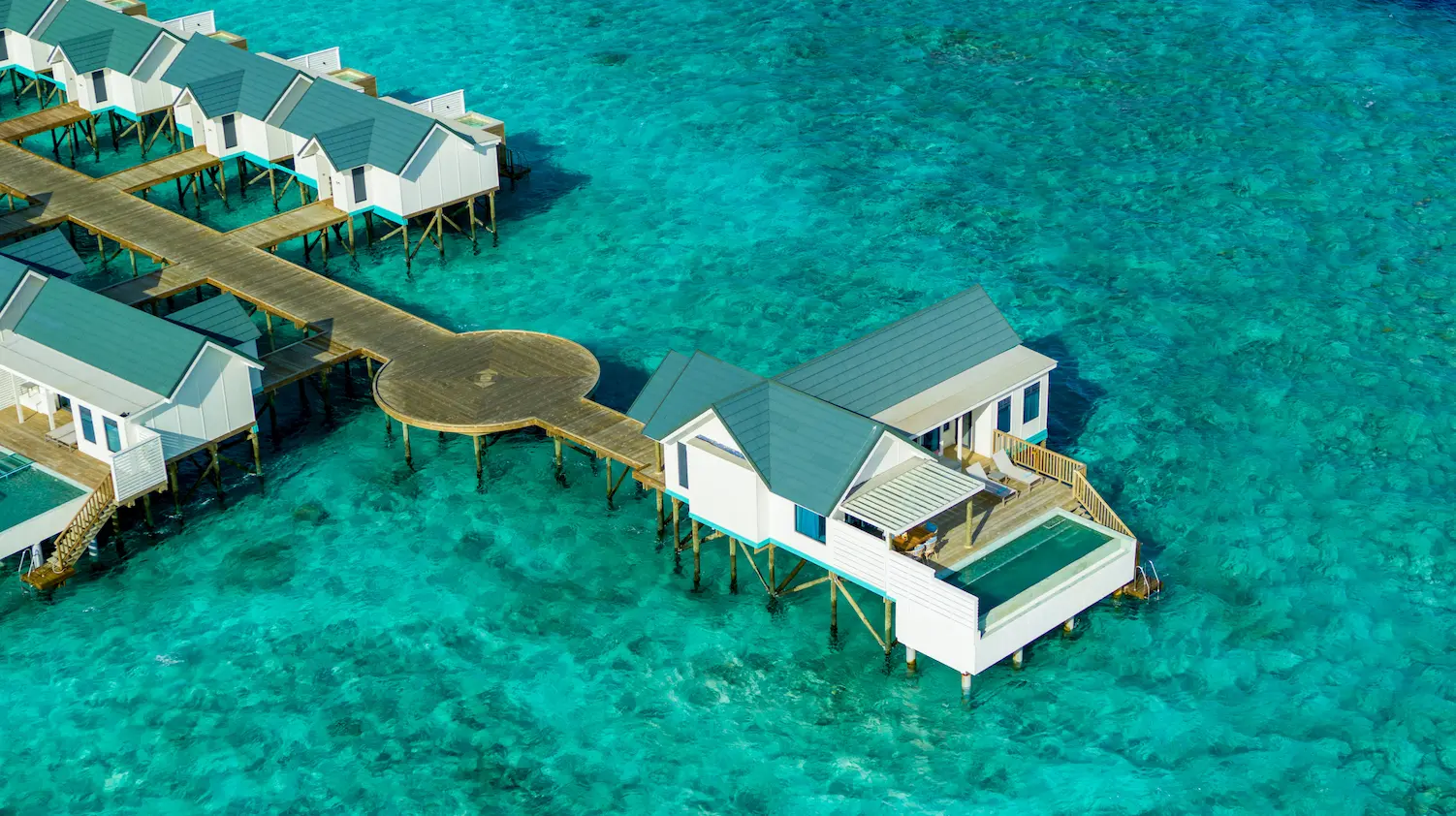 oblu nature helengeli water suite with pool aerial exterior featuring serene overwater setting expansive lagoon views and a calm luxury island atmosphere