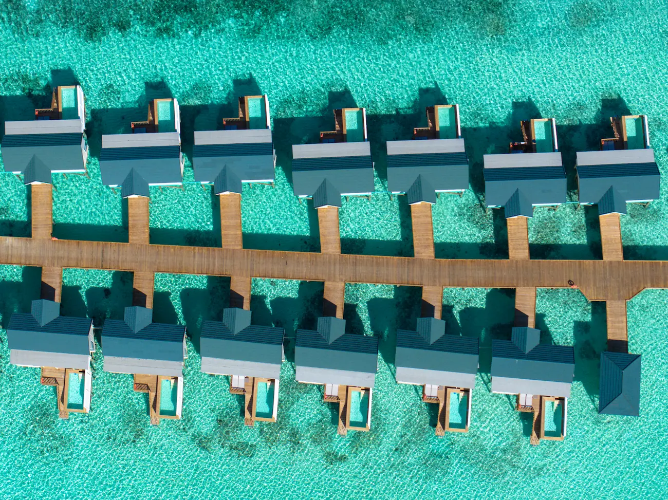 oblu nature helengeli water villa with pool aerial showcasing serene overwater villas turquoise lagoon scenery and a calm island atmosphere