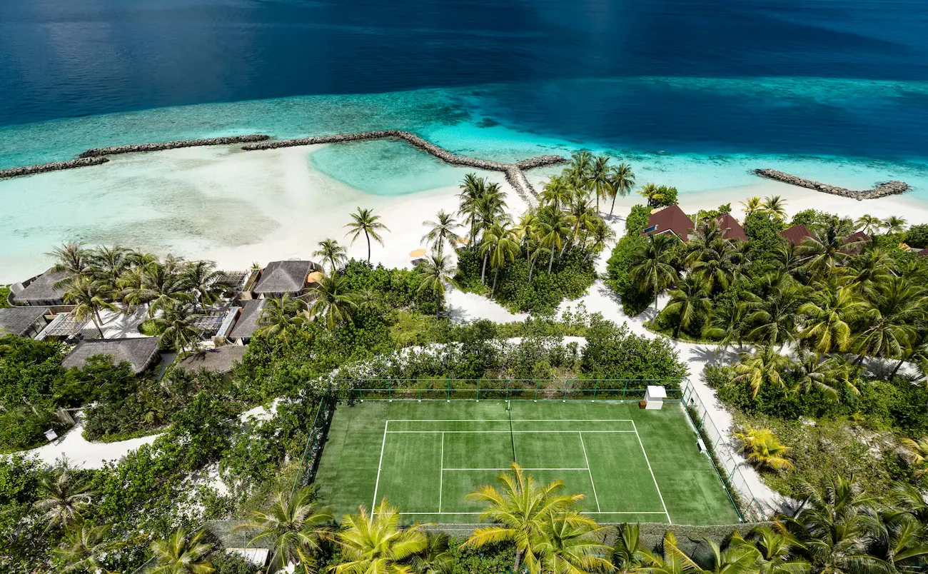 oblu select lobigili maldives island aerial tennis court elevated island view featuring a secluded tennis court surrounded by lush greenery and turquoise waters