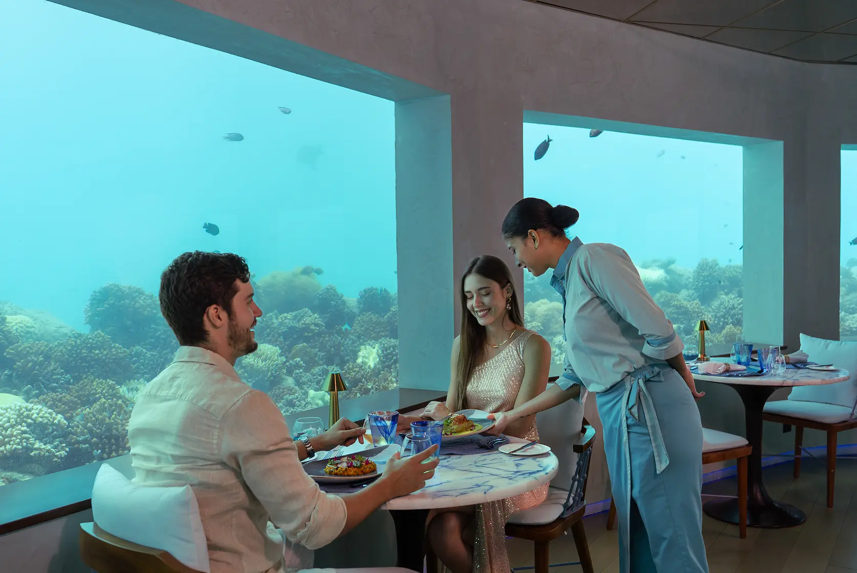 oblu select lobigili maldives only blu under ocean restaurant immersive underwater dining space with panoramic marine views and elegant contemporary design