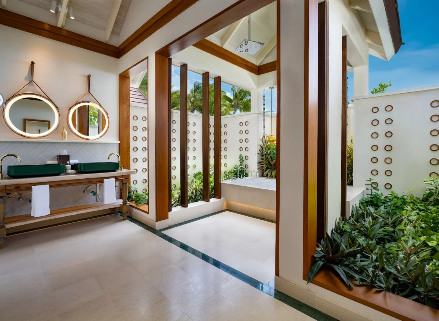 oblu select lobigili maldives sunnest beach pool villa bathroom spacious tropicalinspired bathroom with openair elements soft lighting and elegant island detailing