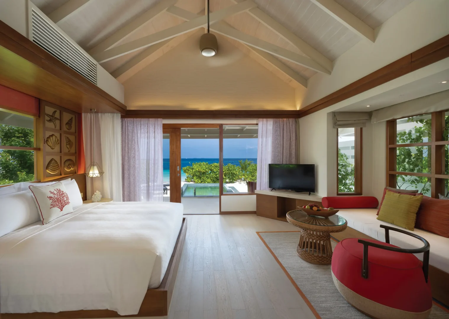 oblu select lobigili maldives sunnest beach pool villa bedroom with view elegant bedroom opening to serene ocean scenery and soft natural light
