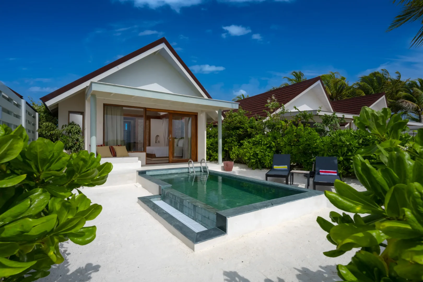 oblu select lobigili maldives sunnest beach pool villa outside tranquil beachfront setting with private pool lush greenery and refined tropical ambience