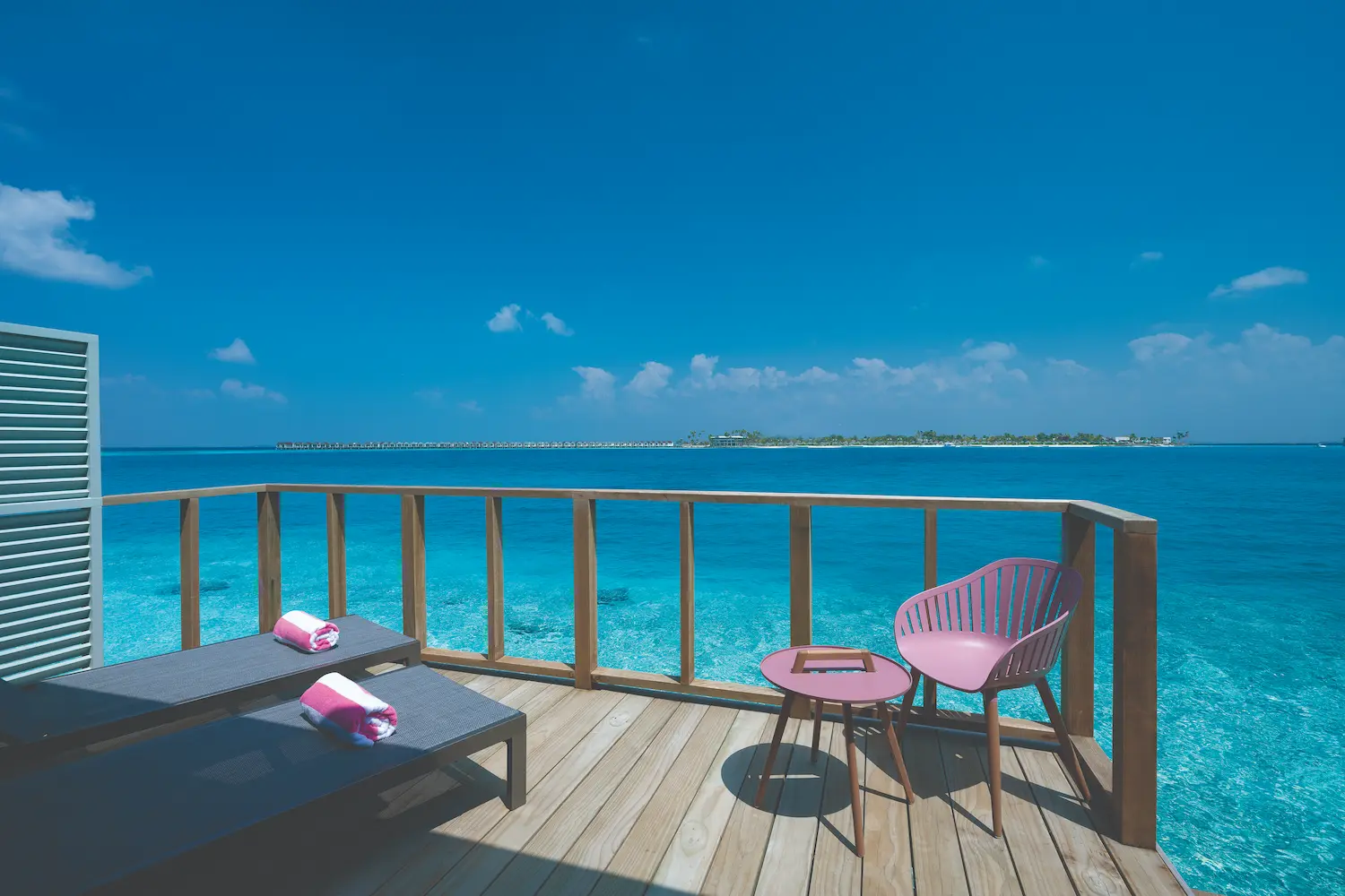oblu select lobigili maldives water villa deck serene overwater deck with ocean views warm wood accents and refined island ambience