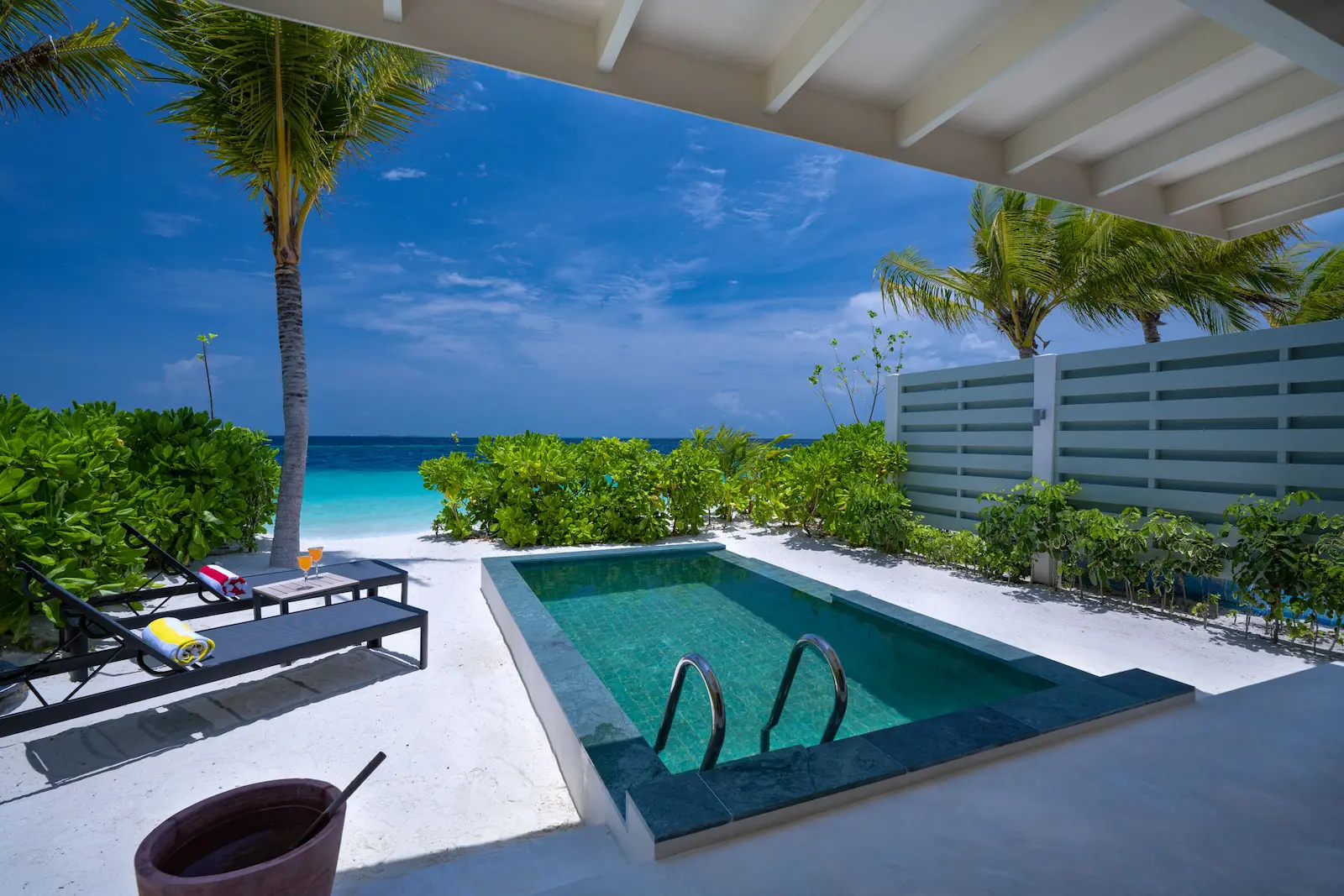 oblu select lobigili male atoll maldives sunnest beach pool villa deck view serene oceanfront deck with luxury pool and tropical ambience