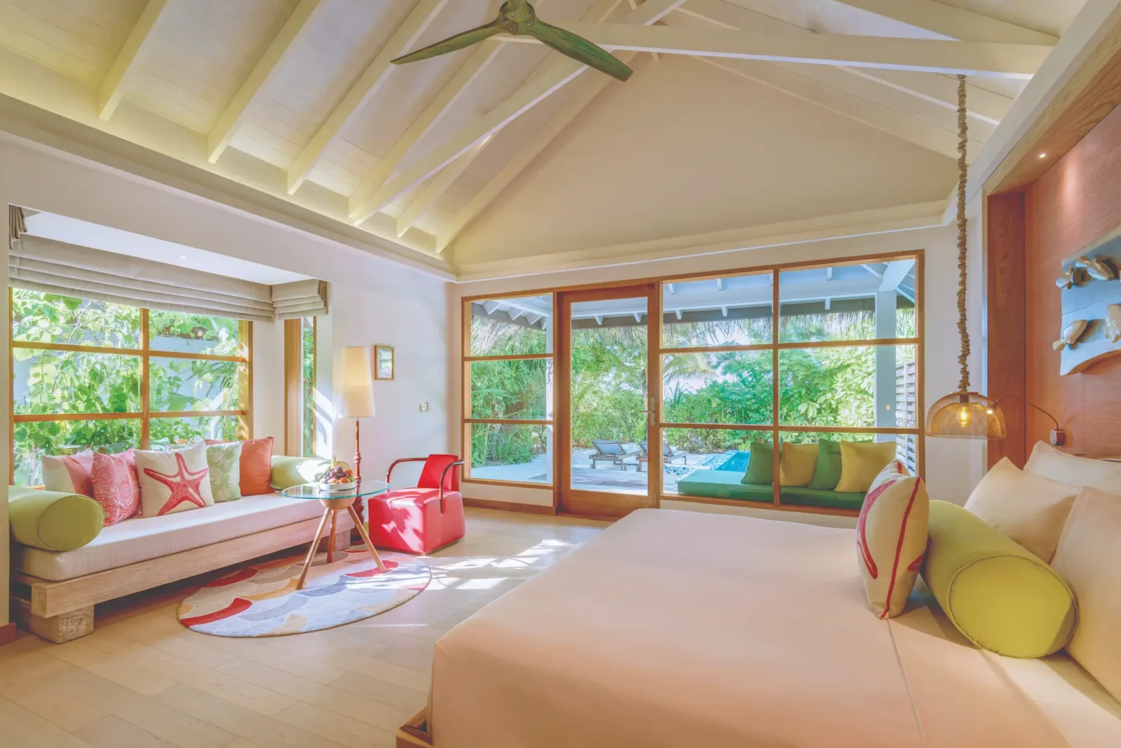 oblu select sangeli maldives beach villa with pool bedroom serene poolside bedroom with warm natural tones soft lighting and refined tropical island ambience