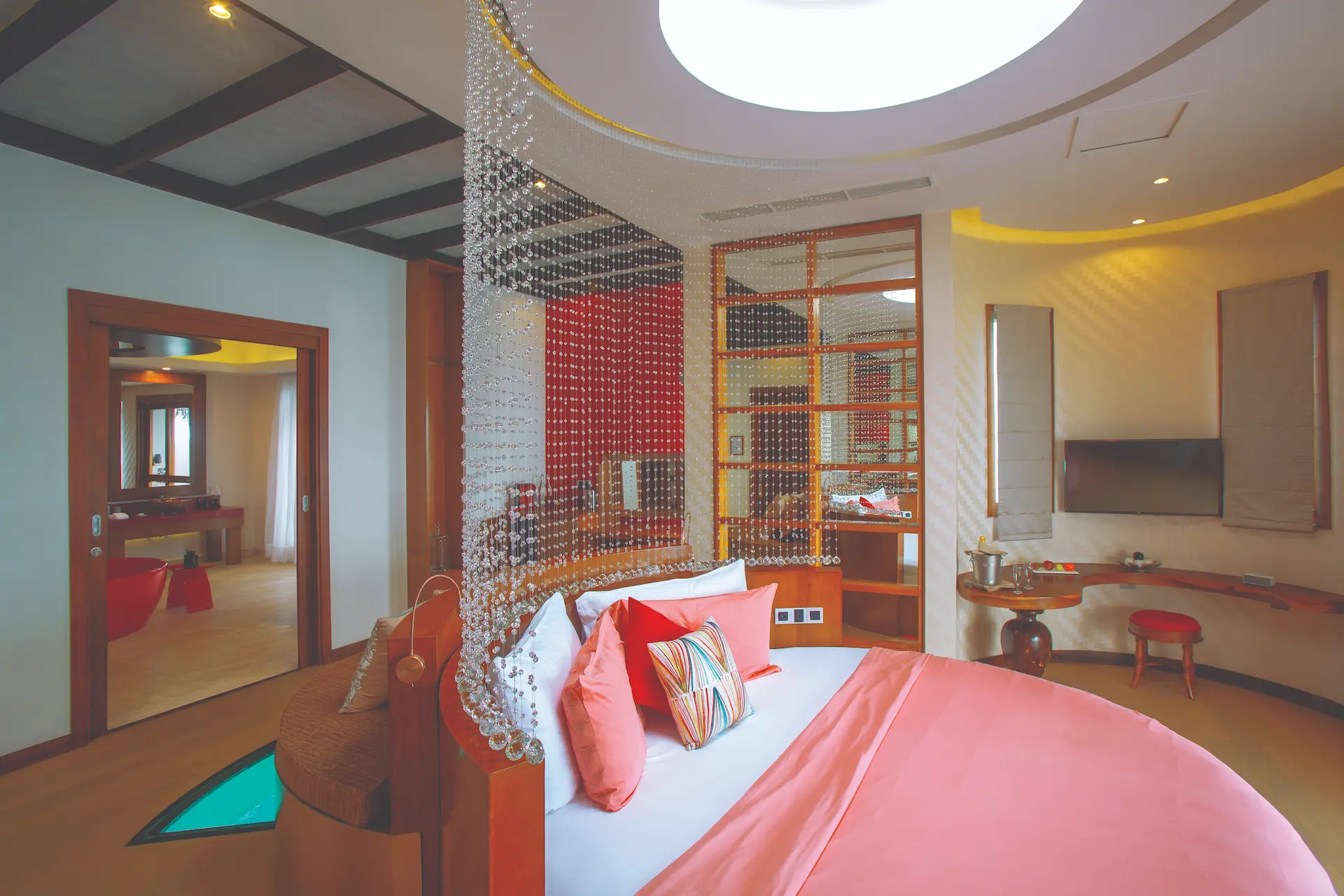 oblu select sangeli maldives honeymoon ocean suite bedroom elegant overwater bedroom with panoramic lagoon vistas warm natural textures and serene tropical ambience