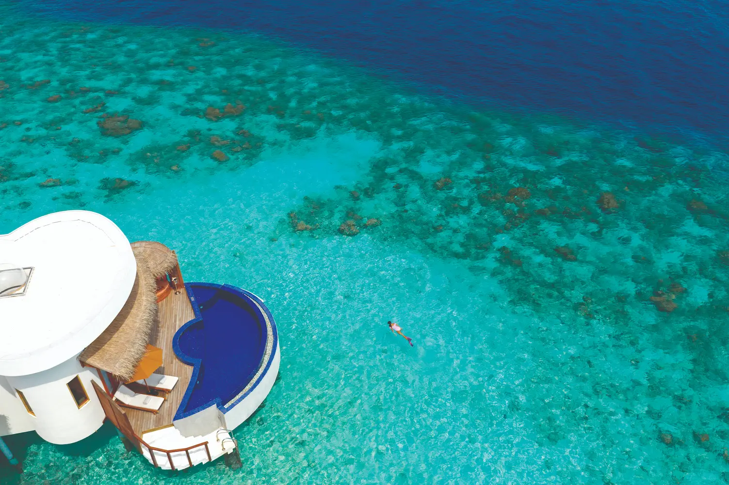 oblu select sangeli maldives honeymoon ocean suite exterior elegant overwater suite exterior with private deck turquoise lagoon backdrop and serene tropical ambience
