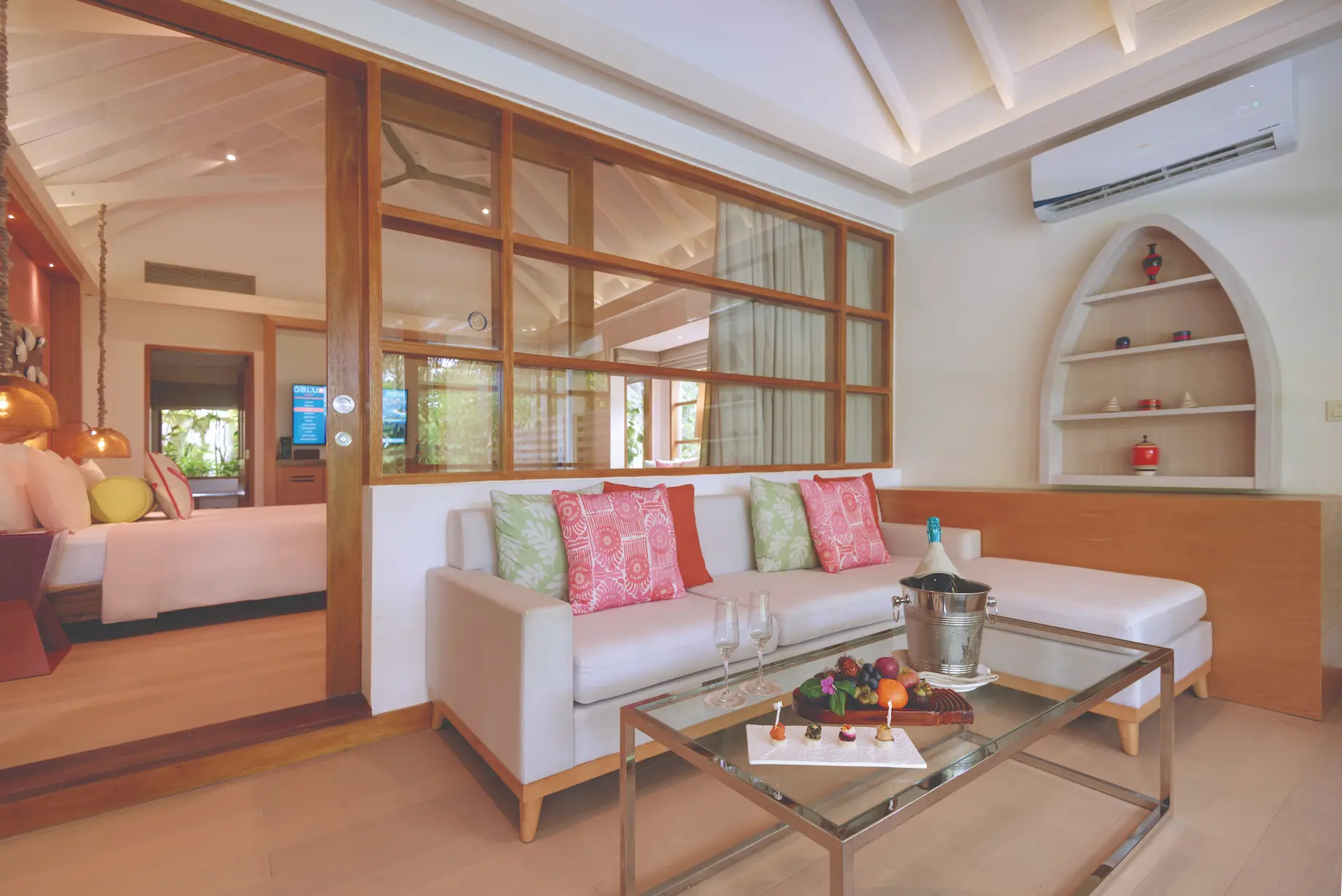 oblu select sangeli maldives two bedroom family villa with pool living room spacious family living room with warm natural tones comfortable seating and serene tropical ambience