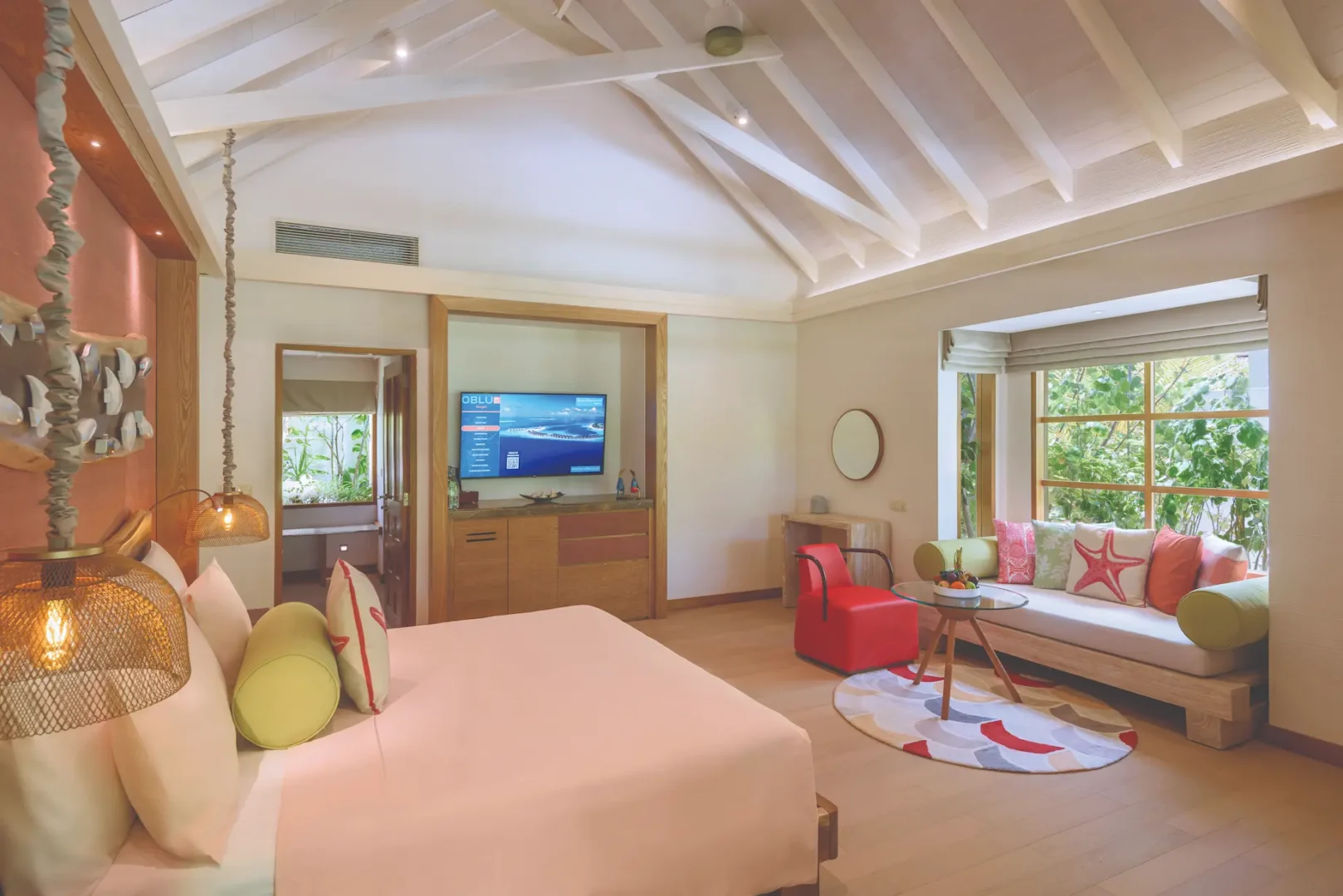 oblu select sangeli maldives two bedroom family villa with pool master bedroom interior elegant master bedroom with warm natural tones soft lighting and serene tropical ambience
