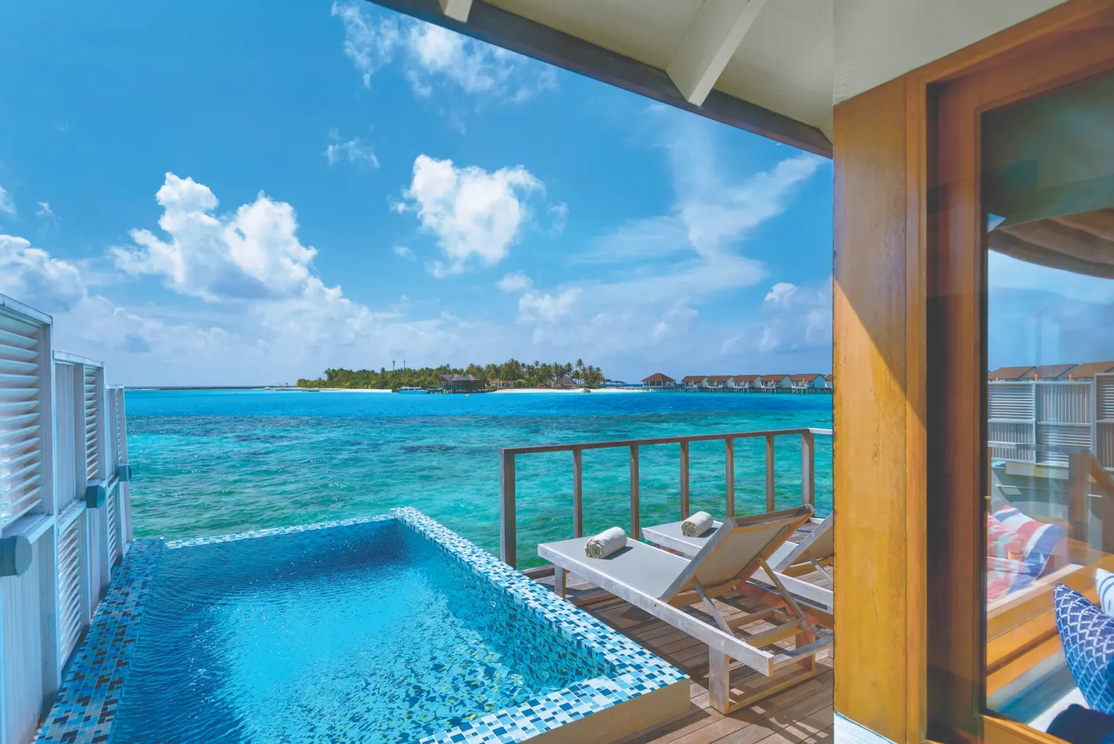 oblu select sangeli maldives water villa with pool exterior view serene overwater pool villa with panoramic lagoon scenery warm wood textures and refined tropical ambience