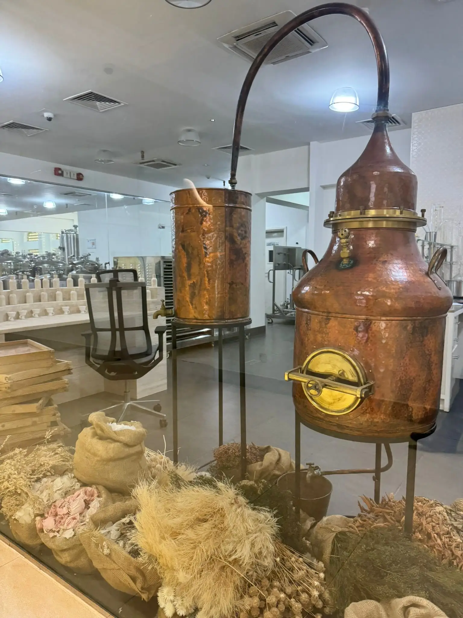 oman amouage perfumery interior with elegant displays of luxury fragrances, ornate décor, and glass shelves showcasing signature perfumes
