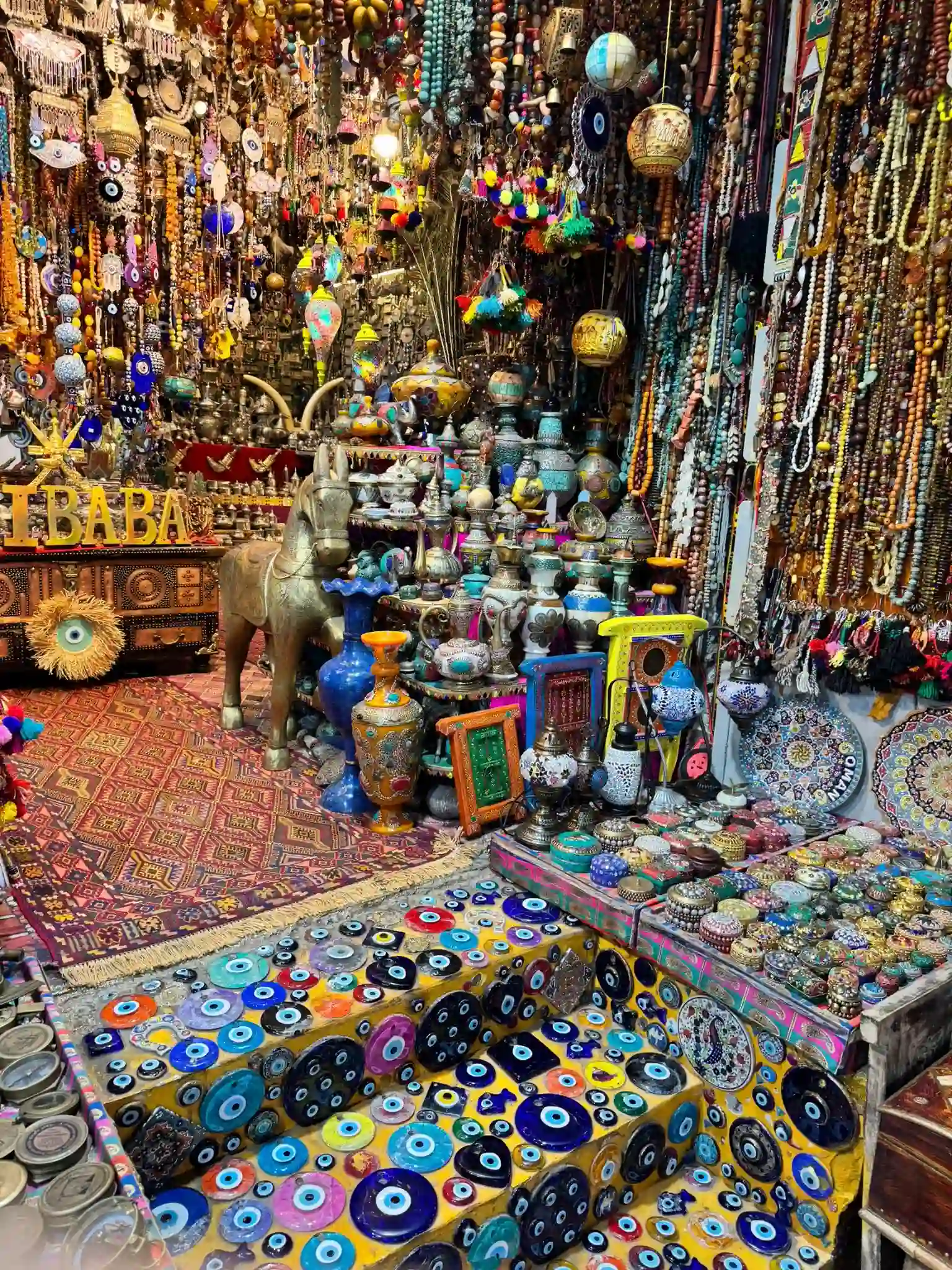 oman market with colorful stalls, traditional textiles, spices, handicrafts, and bustling crowds in a vibrant open-air souq setting