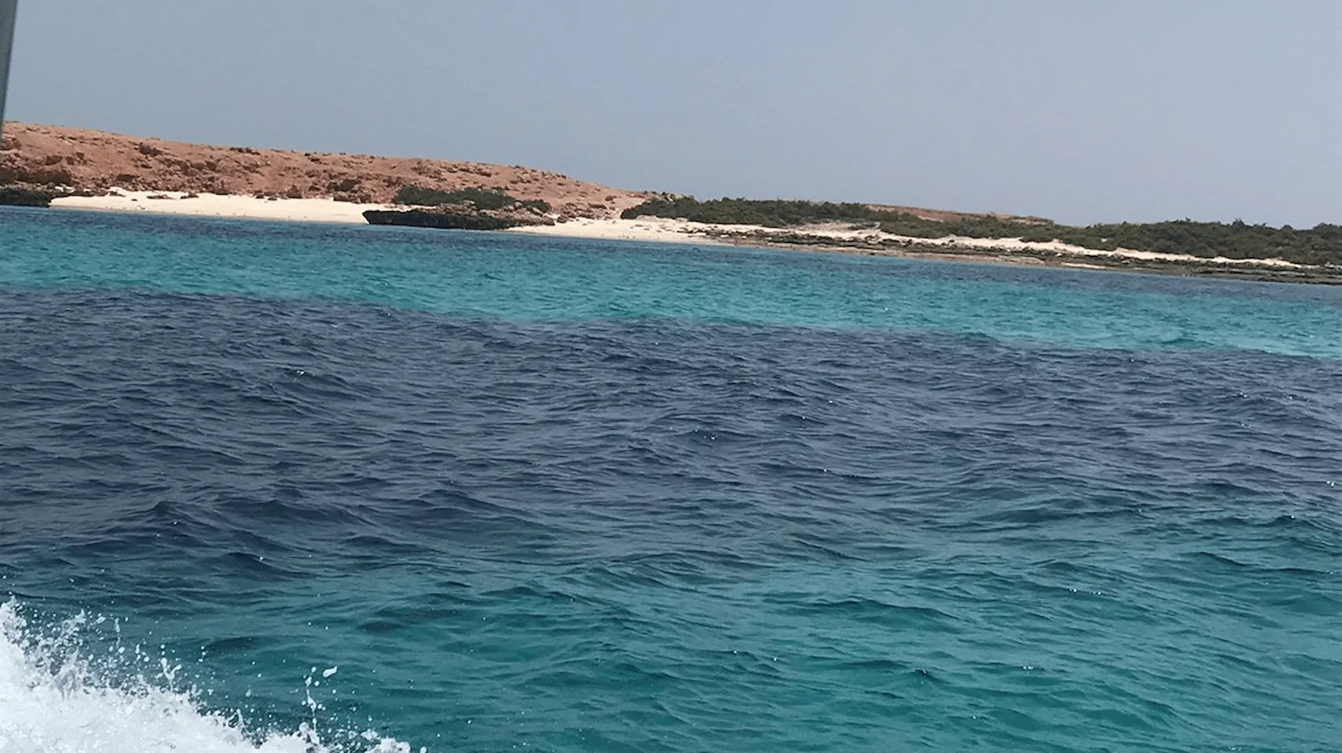 oman snorkelling with clear water colorful fish and coral reef