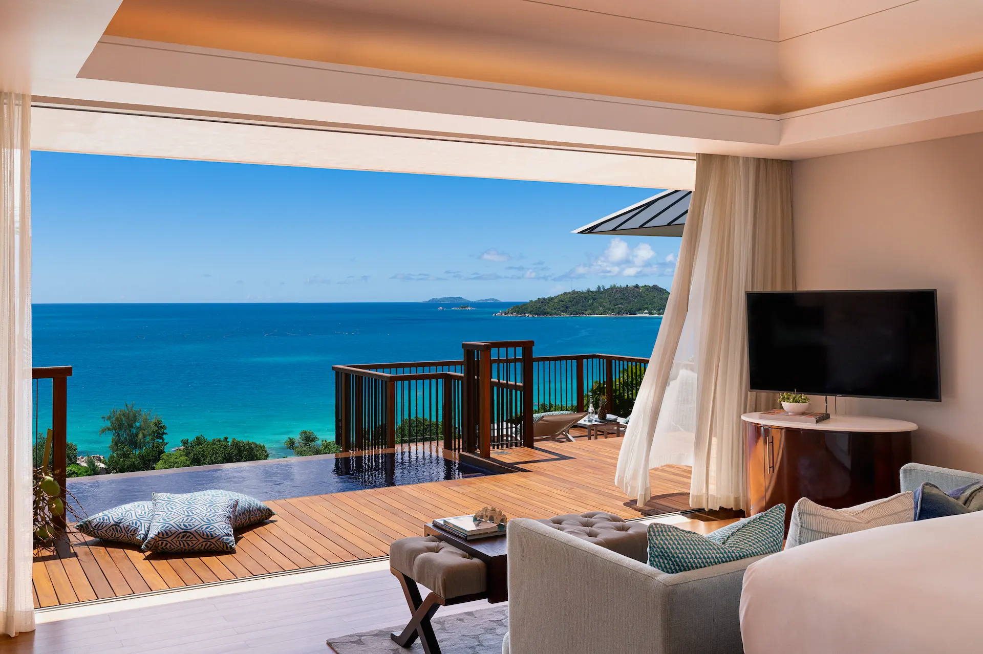 bedroom view of panoramic pool villa in seychelles