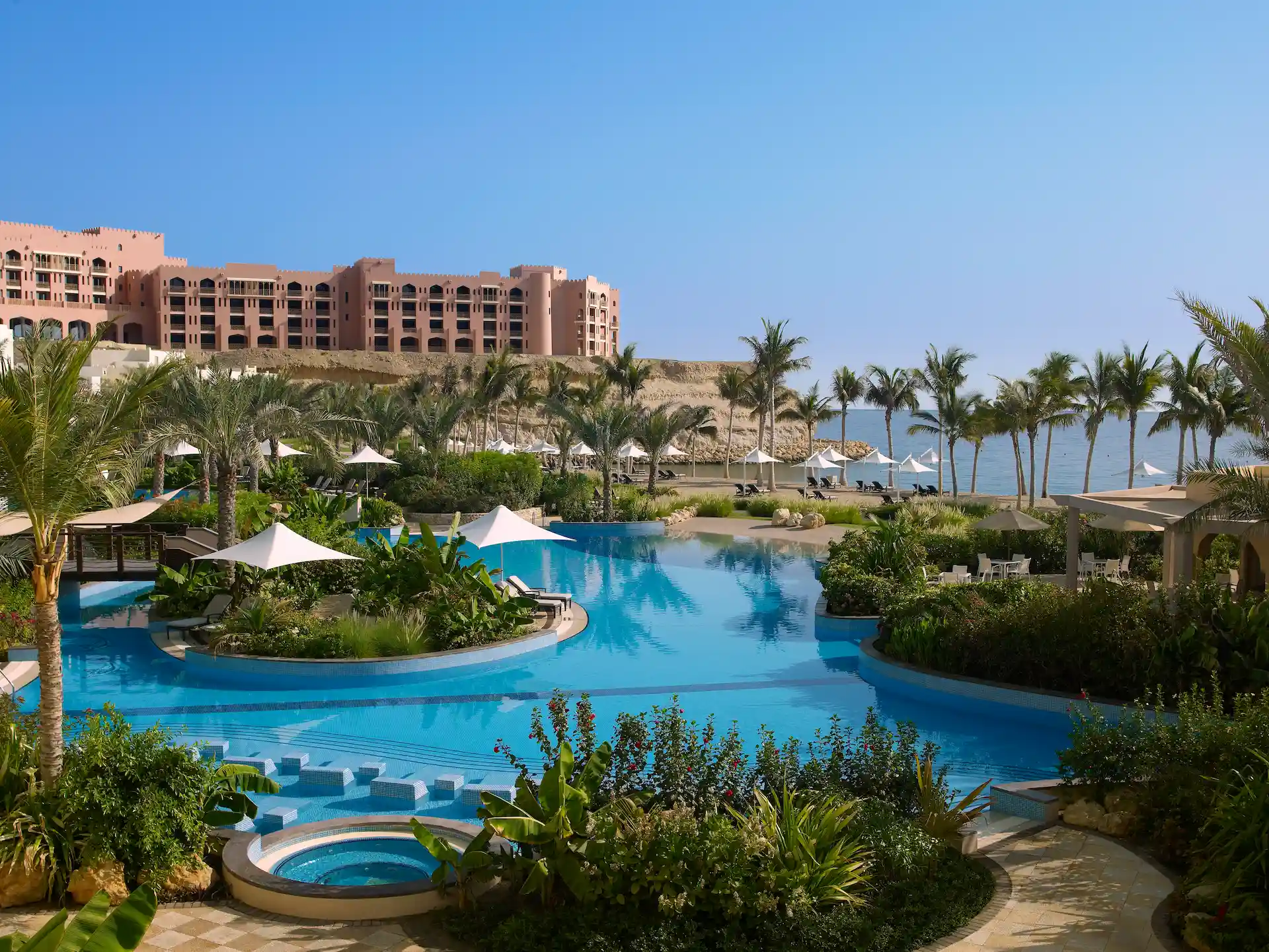 resort swimming pool at hilton muscat al bandar oman