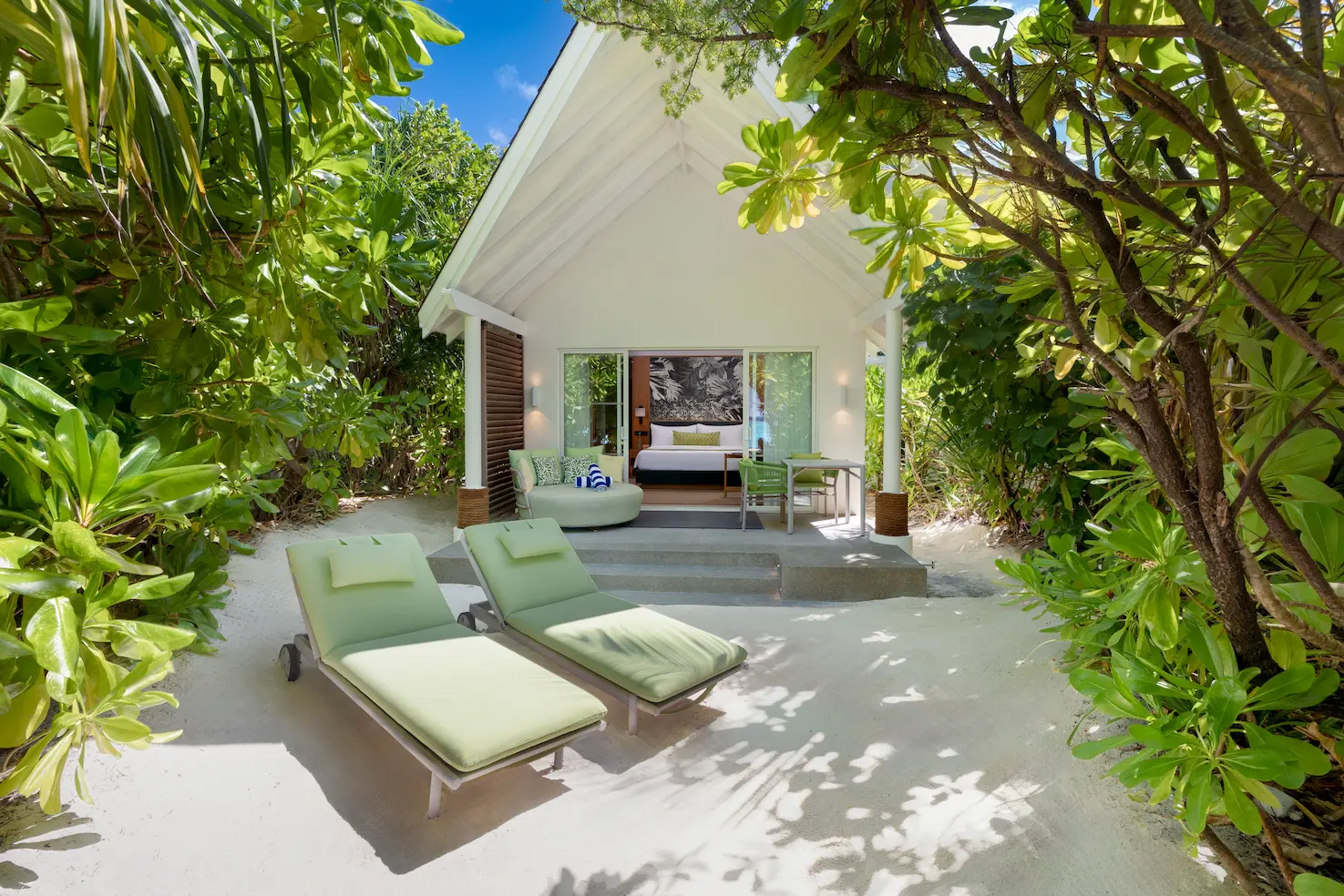 raaya by atmosphere raa atoll maldives beach villa exterior with tranquil coastal setting