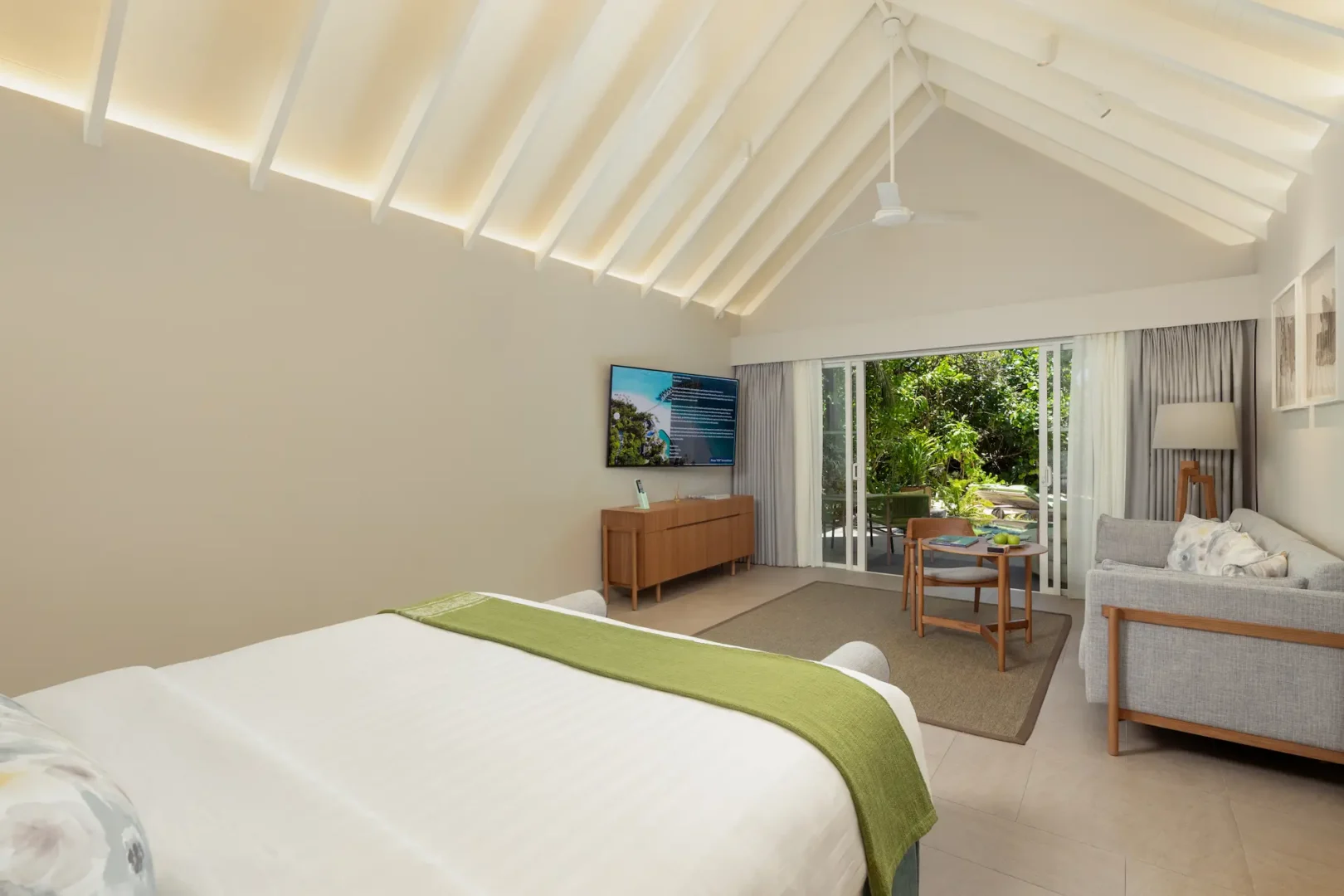 raaya by atmosphere raa atoll maldives beach villa with pool bedroom featuring a serene tropical ambiance