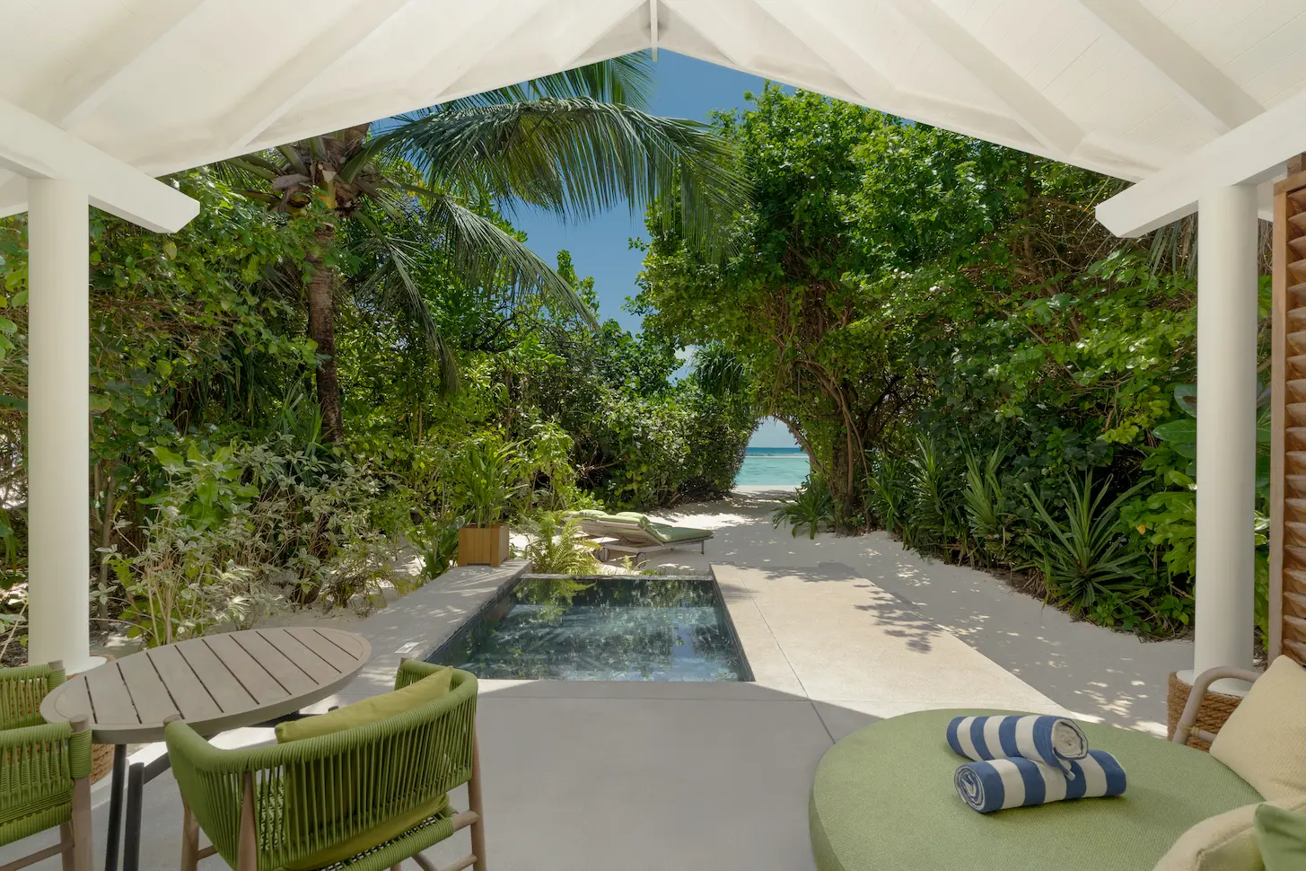 raaya by atmosphere raa atoll maldives beach villa with pool overlooking a serene tropical setting