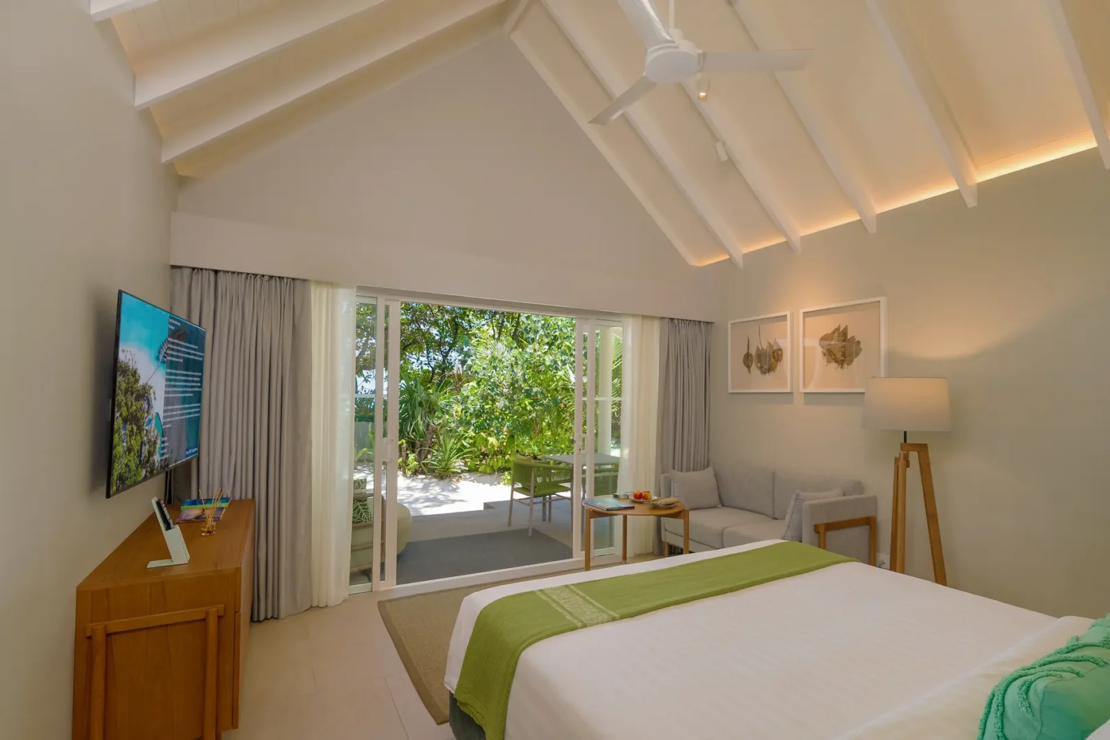 raaya by atmosphere raa atoll maldives family beach villa bedroom view with a serene tropical outlook