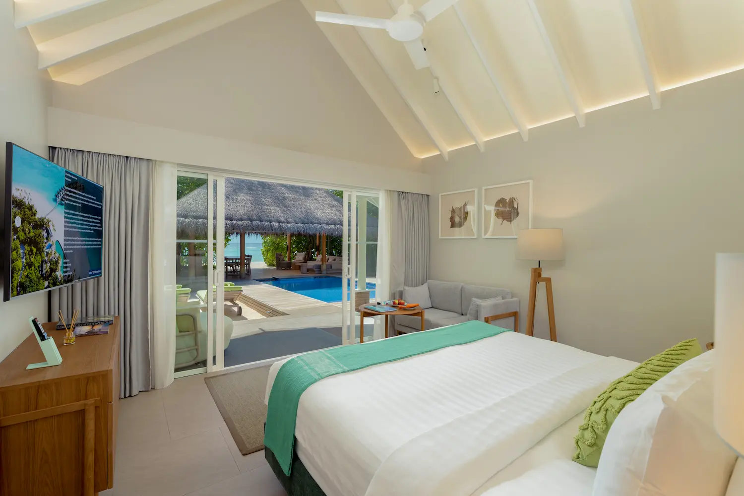 raaya by atmosphere raa atoll maldives family beach villa with pool bed view overlooking a calm tropical seascape