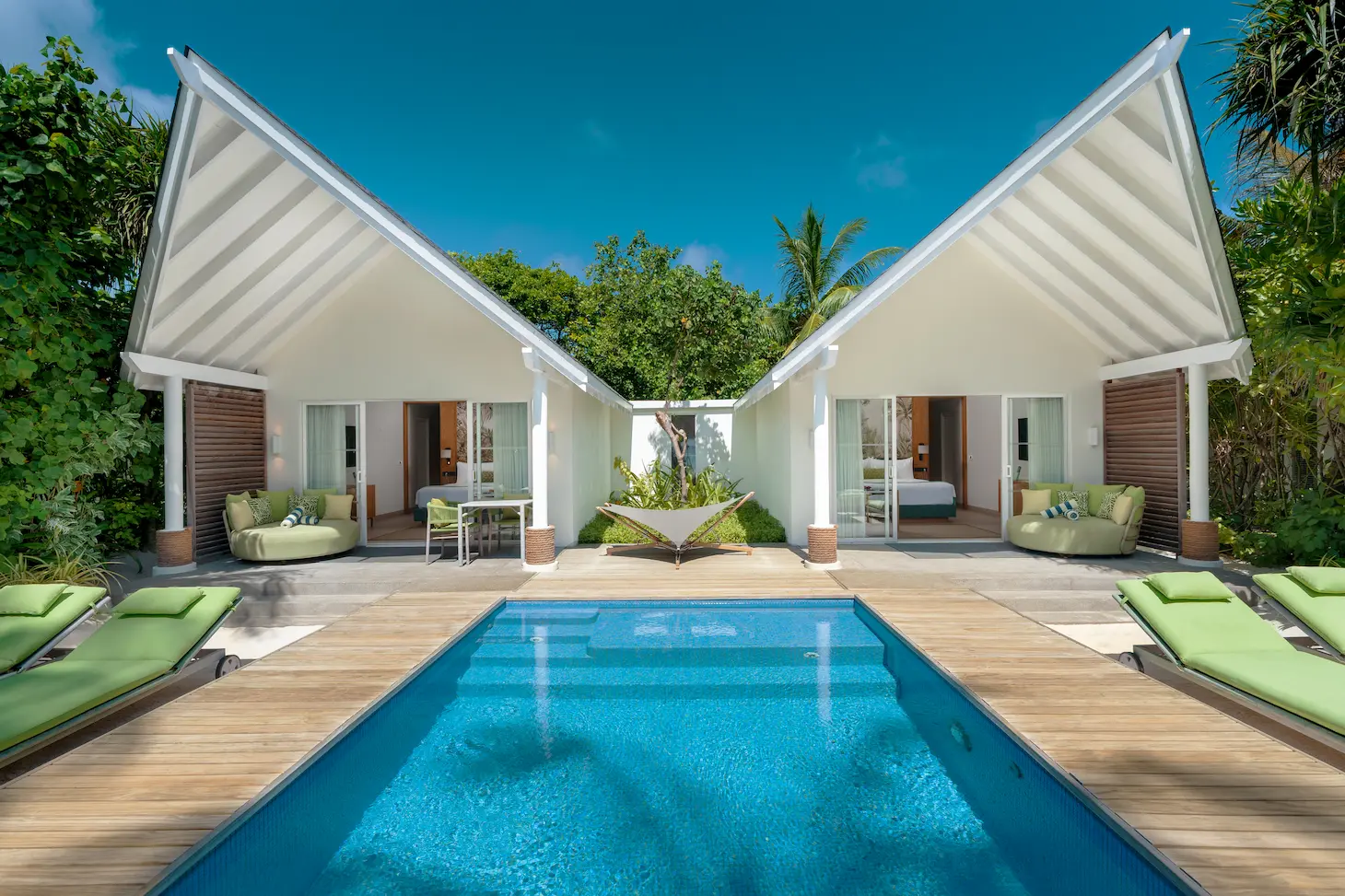 raaya by atmosphere raa atoll maldives family beach villa with pool exterior set within a tranquil tropical landscape