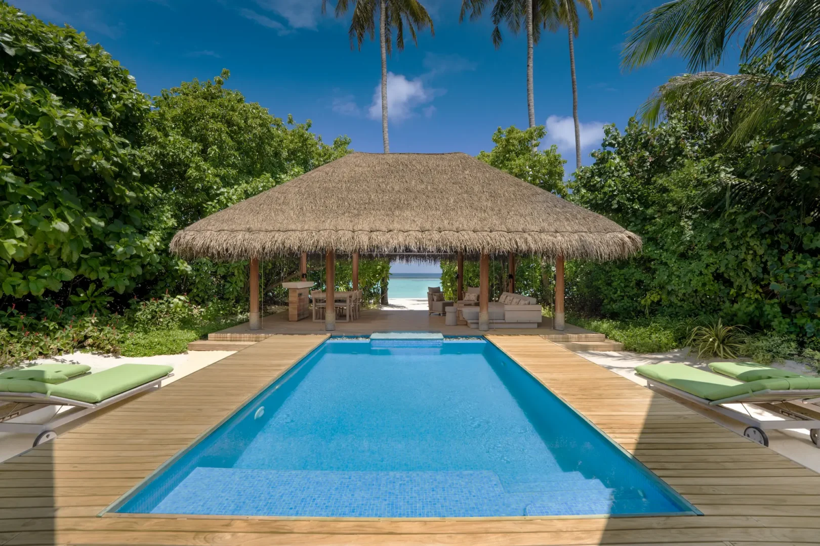 raaya by atmosphere raa atoll maldives family beach villa with pool view overlooking a tranquil tropical seascape
