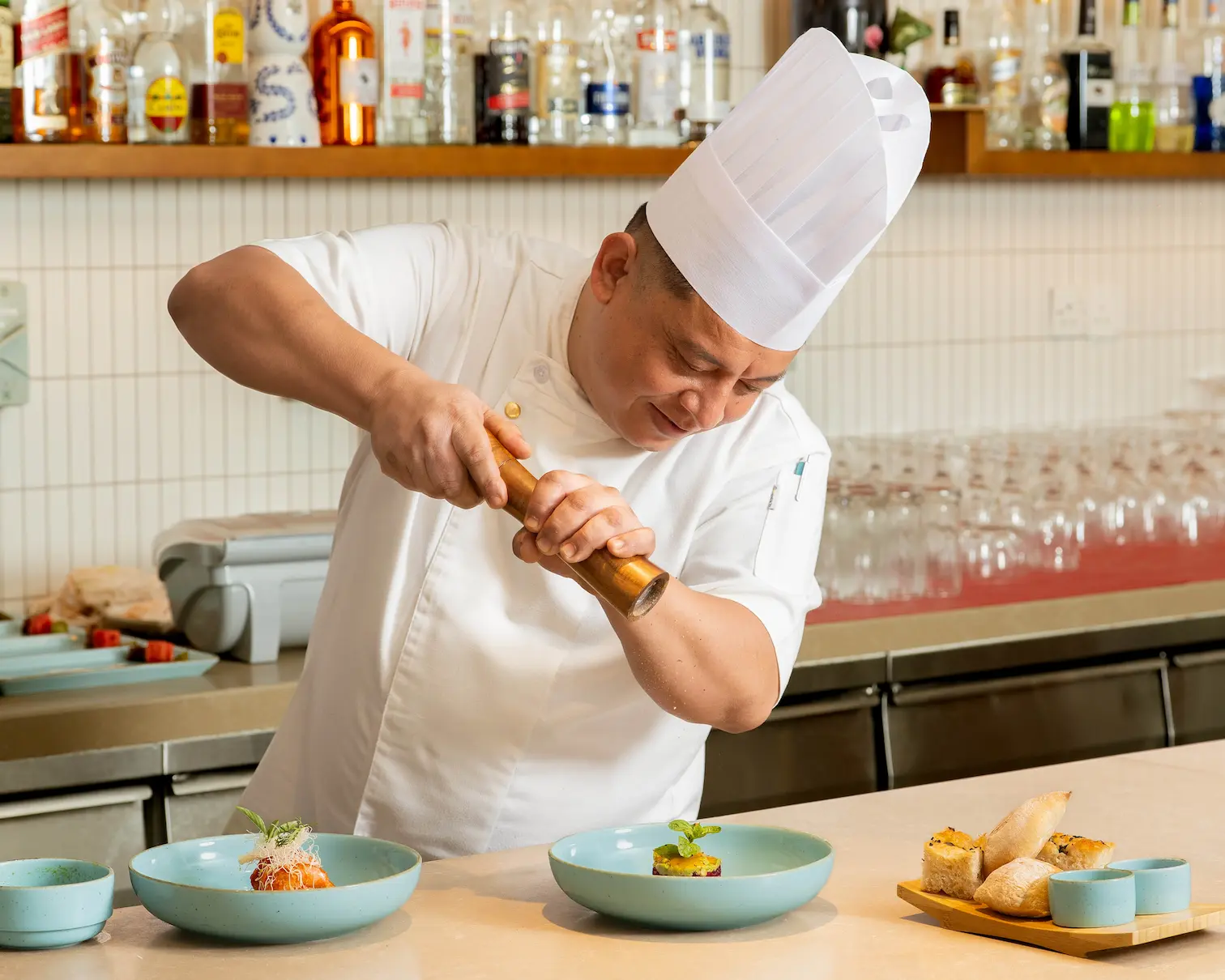 raaya by atmosphere raa atoll maldives the village showcasing a vibrant tropical dining setting