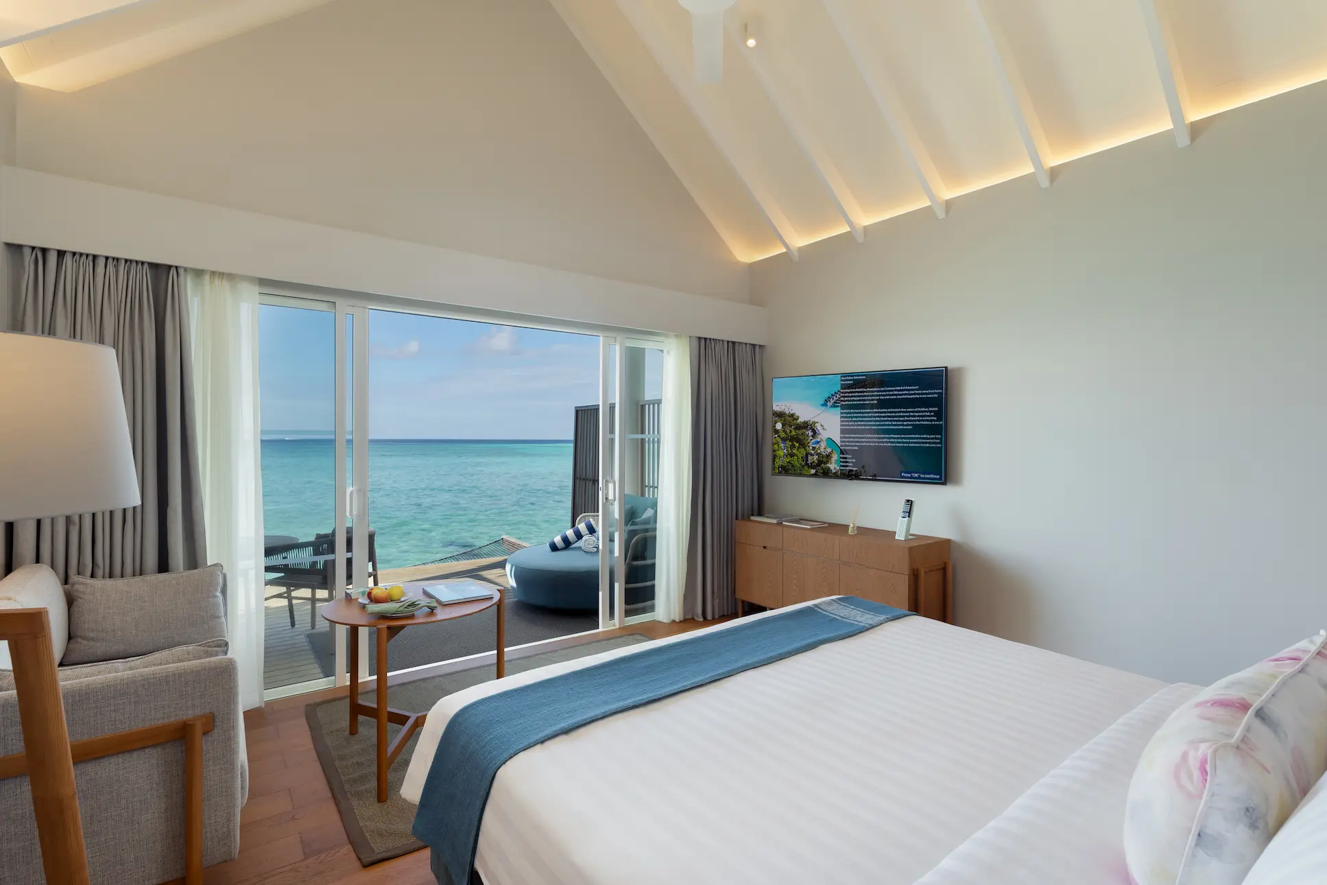 raaya by atmosphere raa atoll maldives water villa bedroom terrace with calm ocean atmosphere