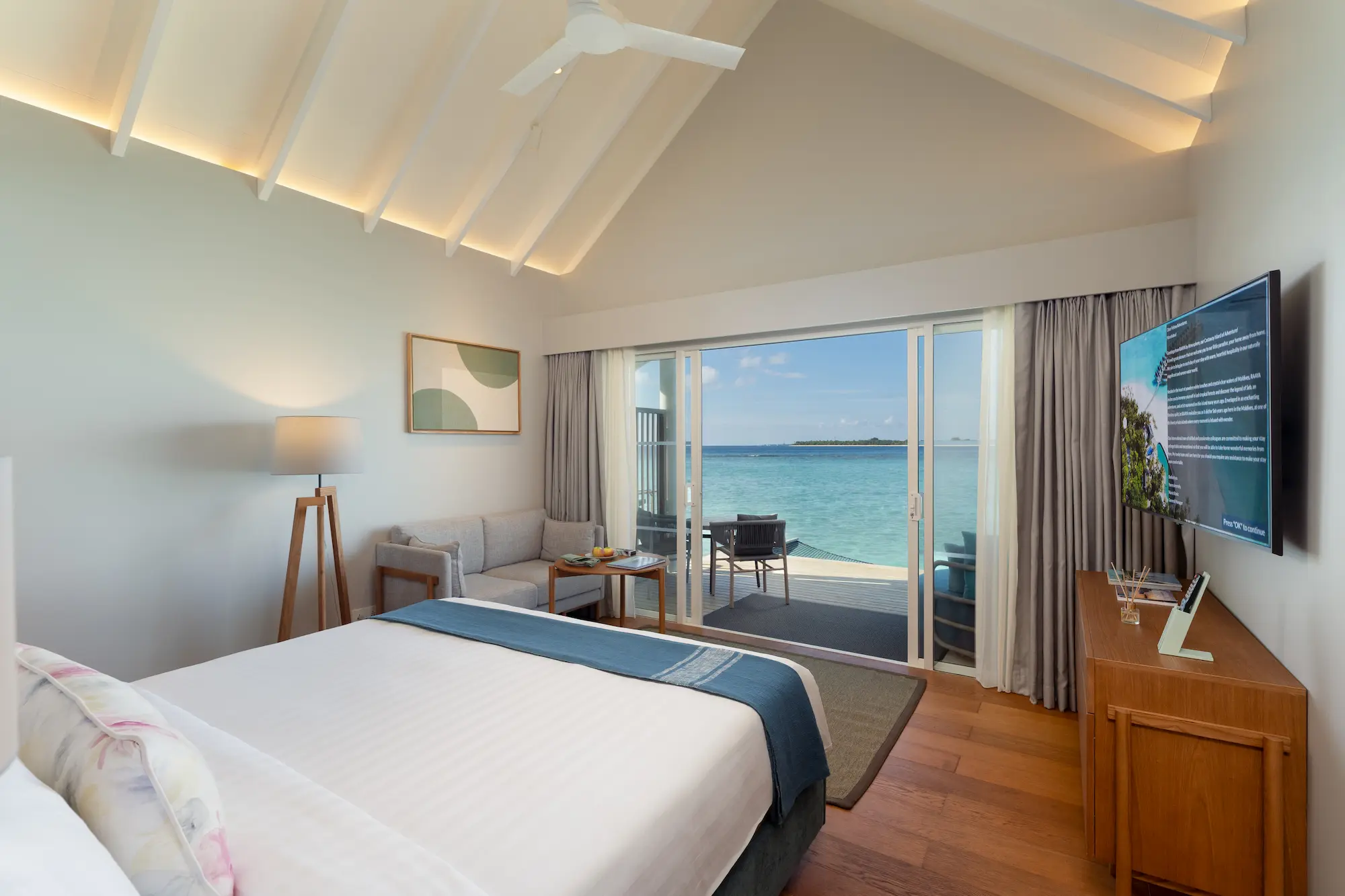 raaya by atmosphere raa atoll maldives water villa bedroom view with serene ocean horizon