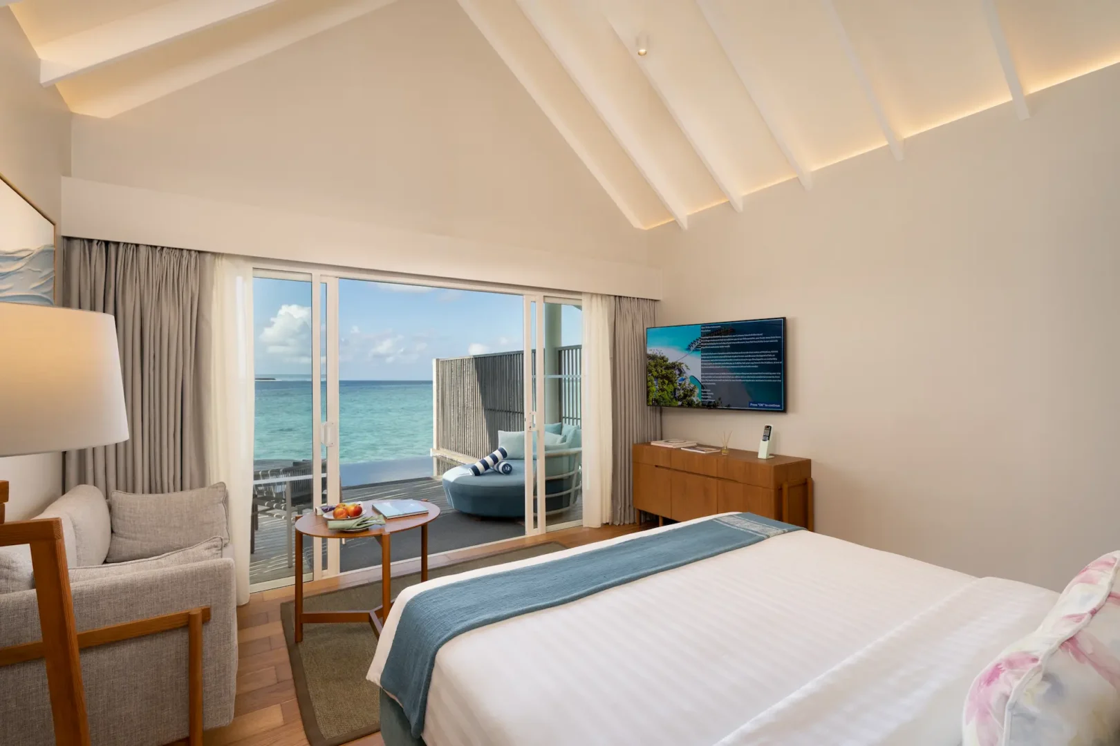 raaya by atmosphere raa atoll maldives water villa with pool terrace overlooking a peaceful tropical seascape