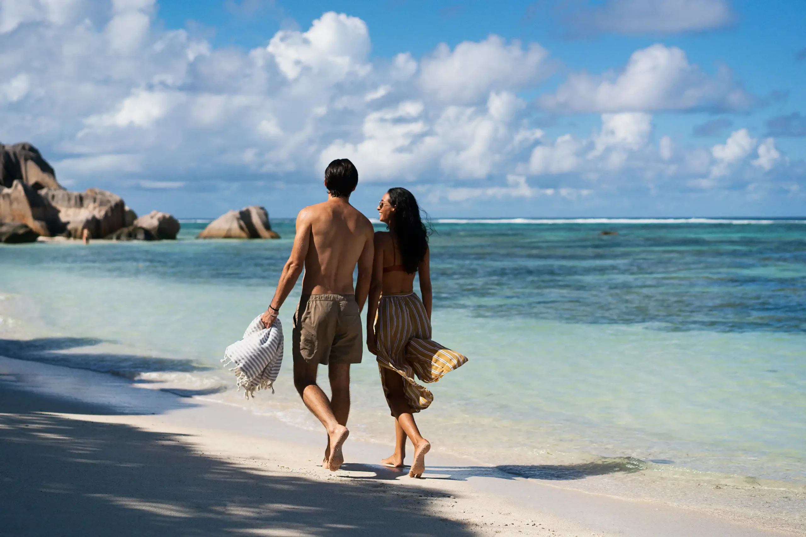scenic beach walk at raffles seychelles along white sand shore