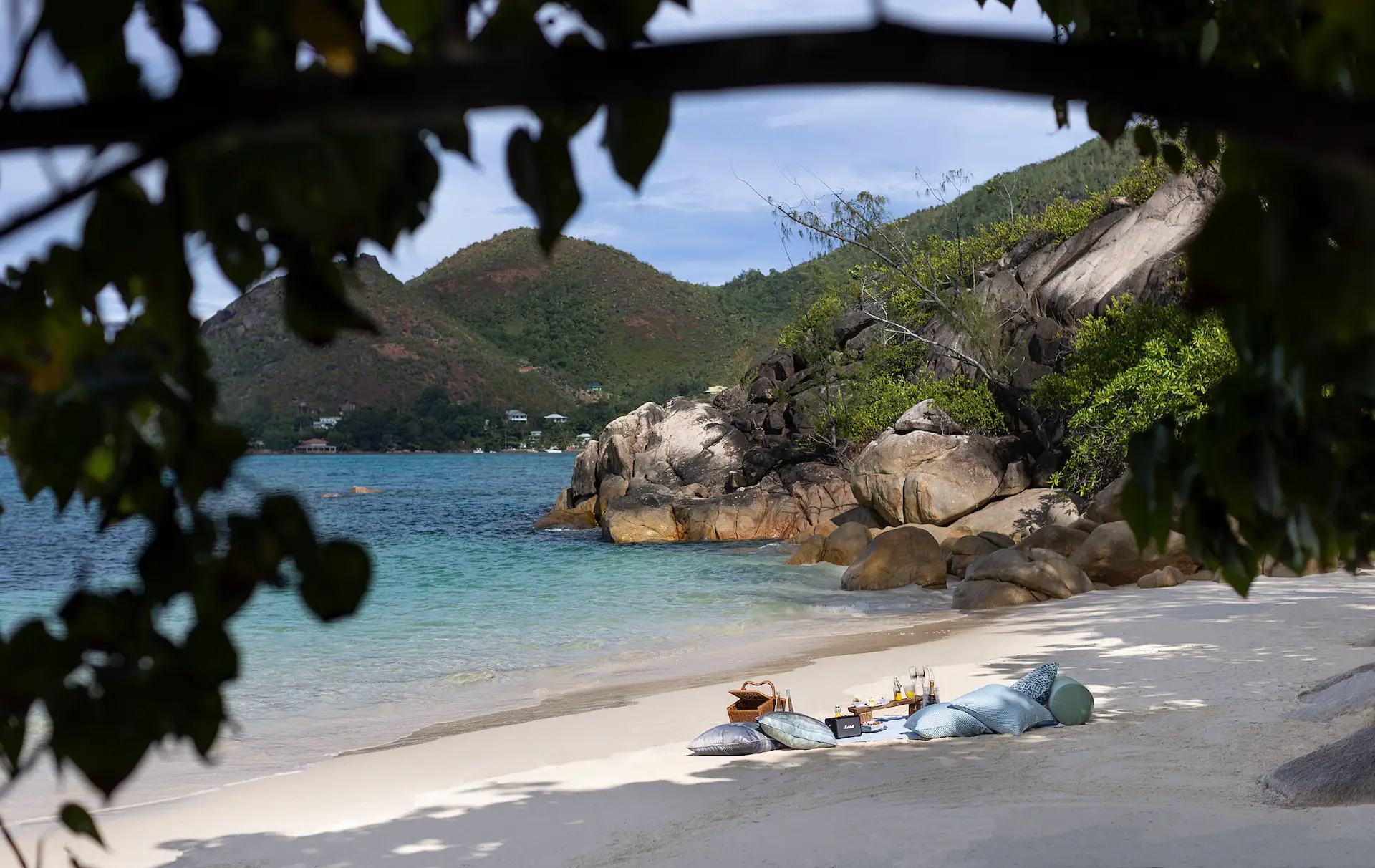 picnic setup at raffles seychelles on the beach with white sand