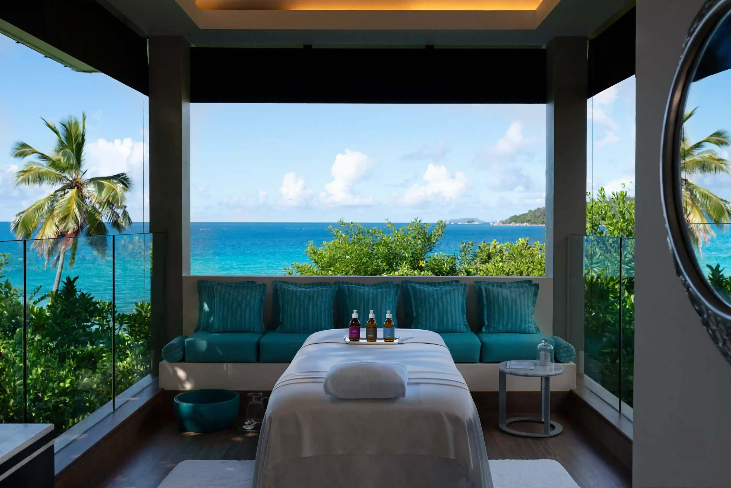 spa at raffles seychelles overlooking turquoise sea with tropical greenery and serene surroundings