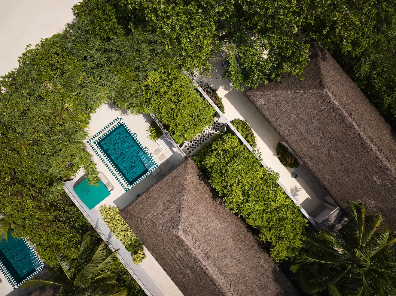seaside finolhu aerial view of interconnecting pathway surrounded by turquoise lagoon lush greenery and serene maldives island ambience