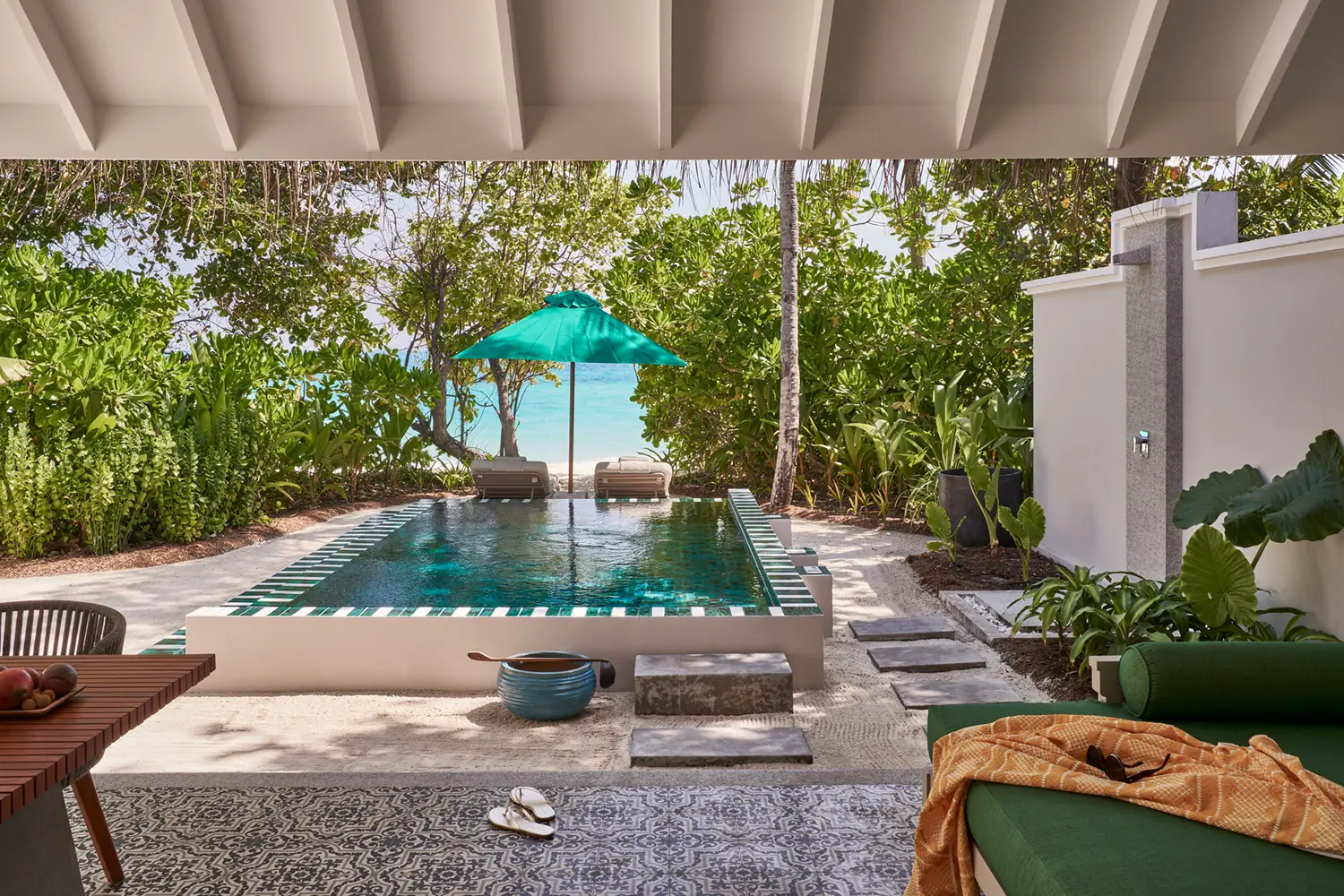 seaside finolhu beach pool villa terrace two bedroom interconnecting beach villa featuring private outdoor lounging space tropical greenery and serene maldives island ambience