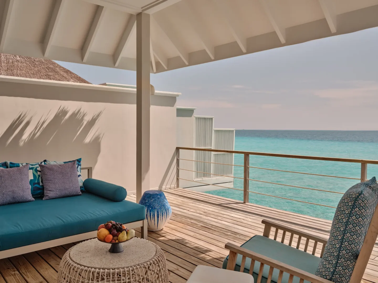 seaside finolhu lagoon villa terrace with overwater lounging space tropical island views and serene maldives ambience