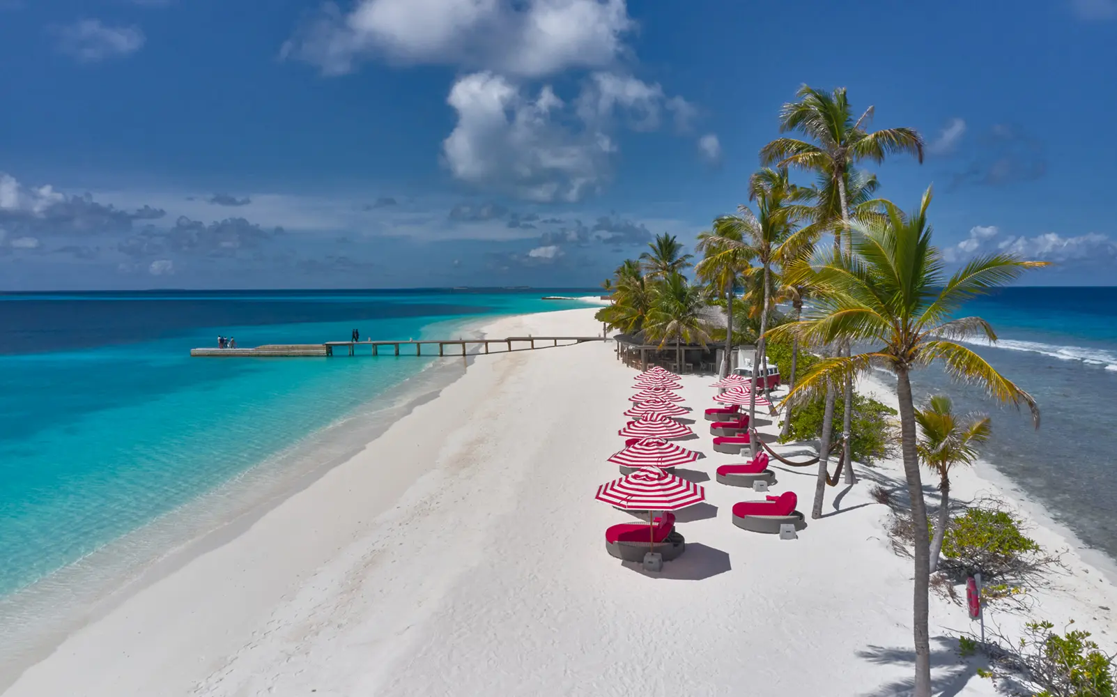 seaside finolhu maldives crab shack drone elevated coastal view capturing the rustic beachfront restaurant surrounded by turquoise waters