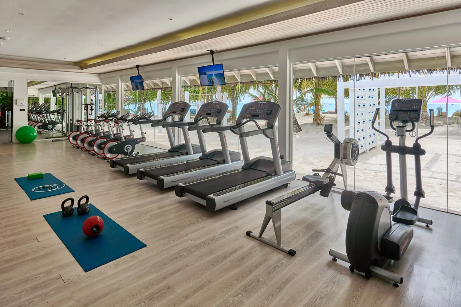 seaside finolhu maldives fitness area modern workout space with natural light and calming island atmosphere