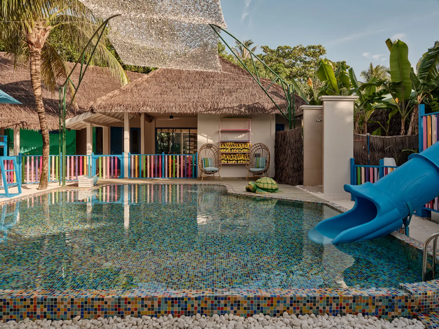 seaside finolhu maldives oceaneers club pool area vibrant family friendly pool space with gentle island light and playful coastal surroundings